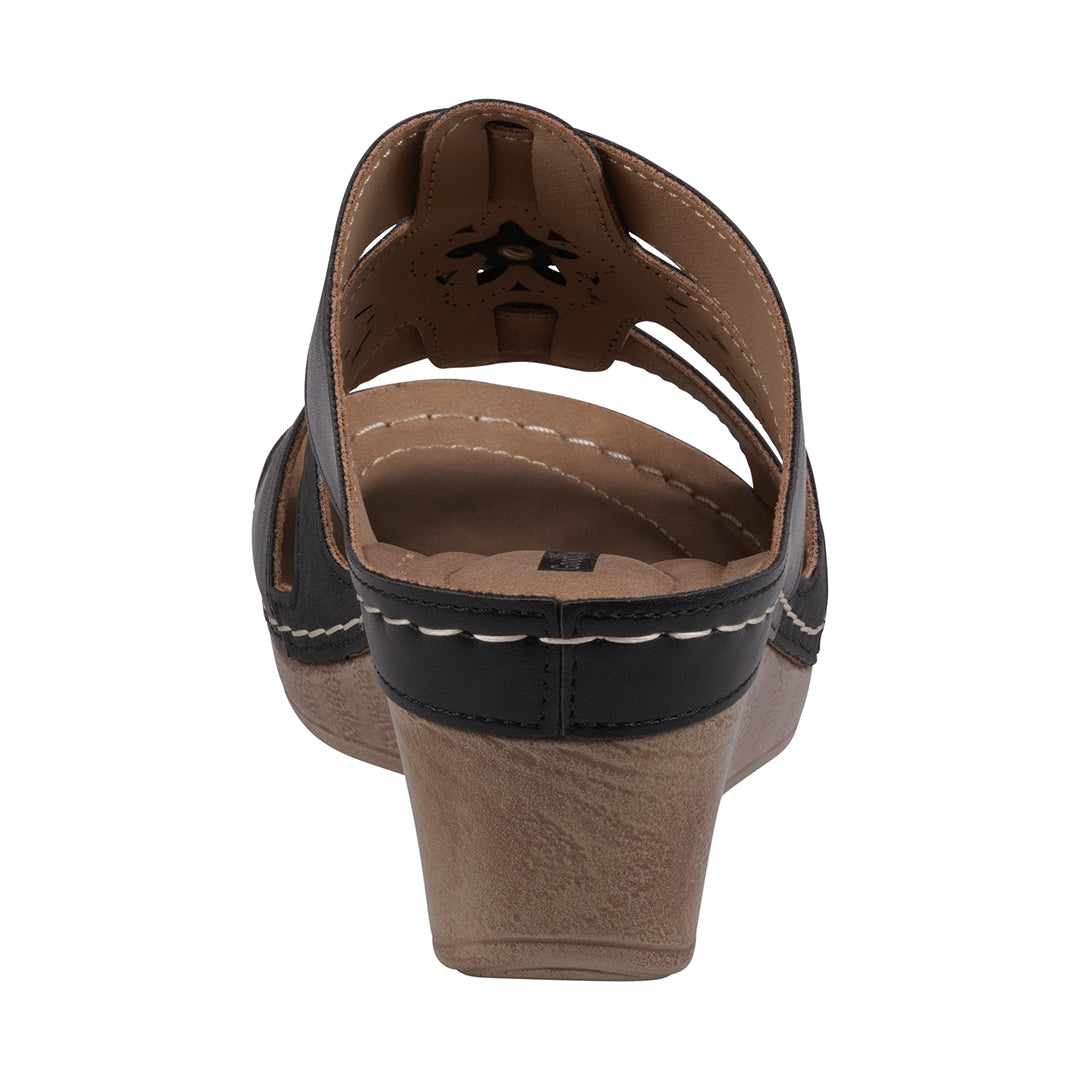 Brown sandal with a wedge heel on a white background
