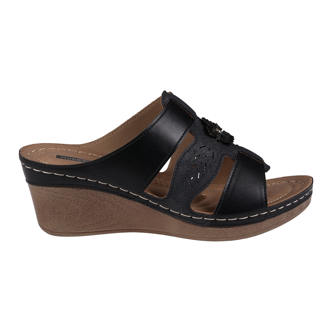 Black wedge sandal with brown sole on a white background