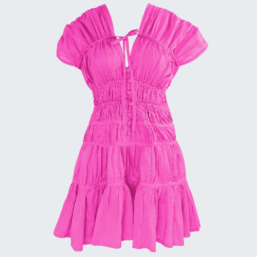 Pink dress with ruffled layers on a white background