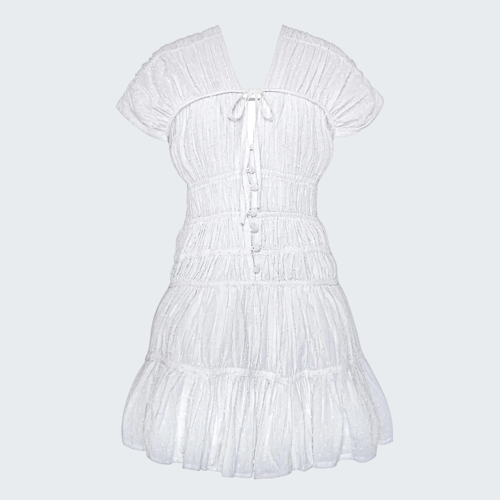 White dress with ruffled details on a white background