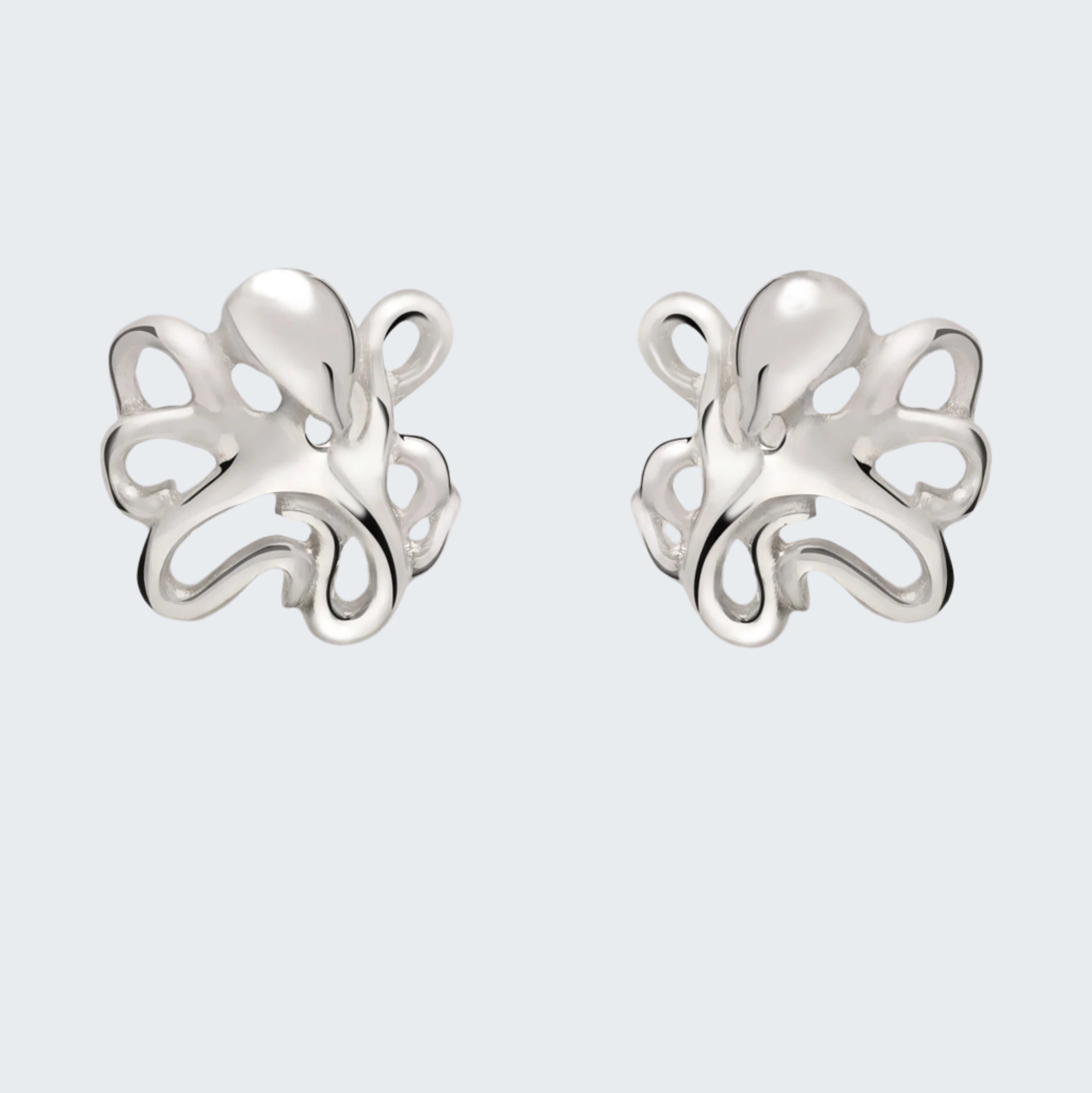 Pair of silver octopus-shaped earrings on a light gray background