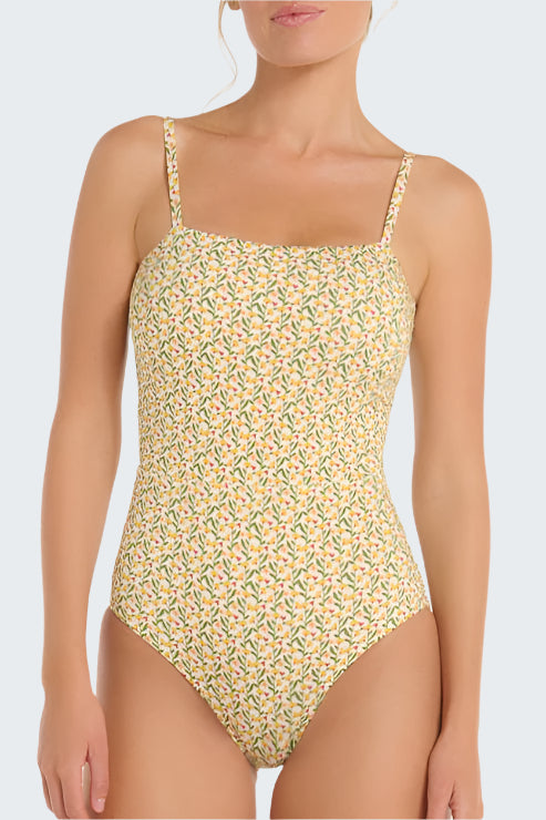 Floral patterned one-piece swimsuit worn by a model on a white background