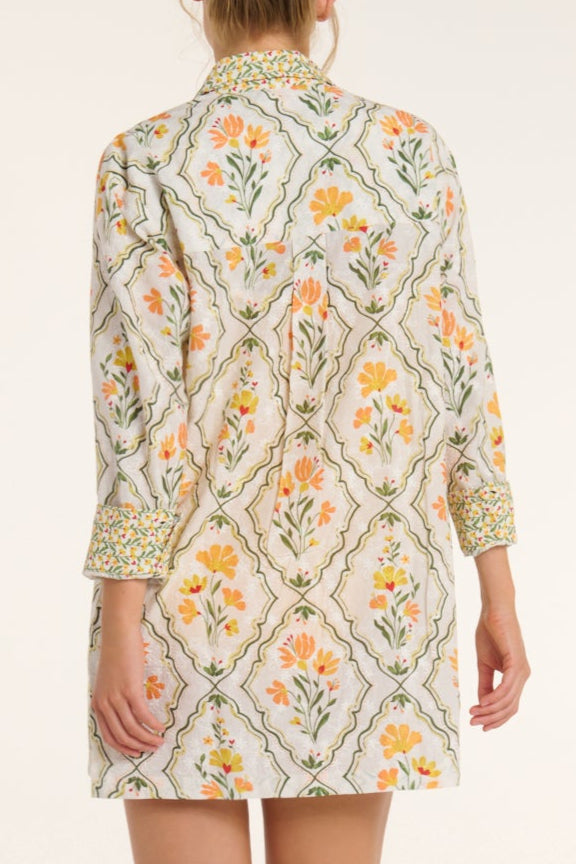 Floral patterned dress with a geometric design on a white background