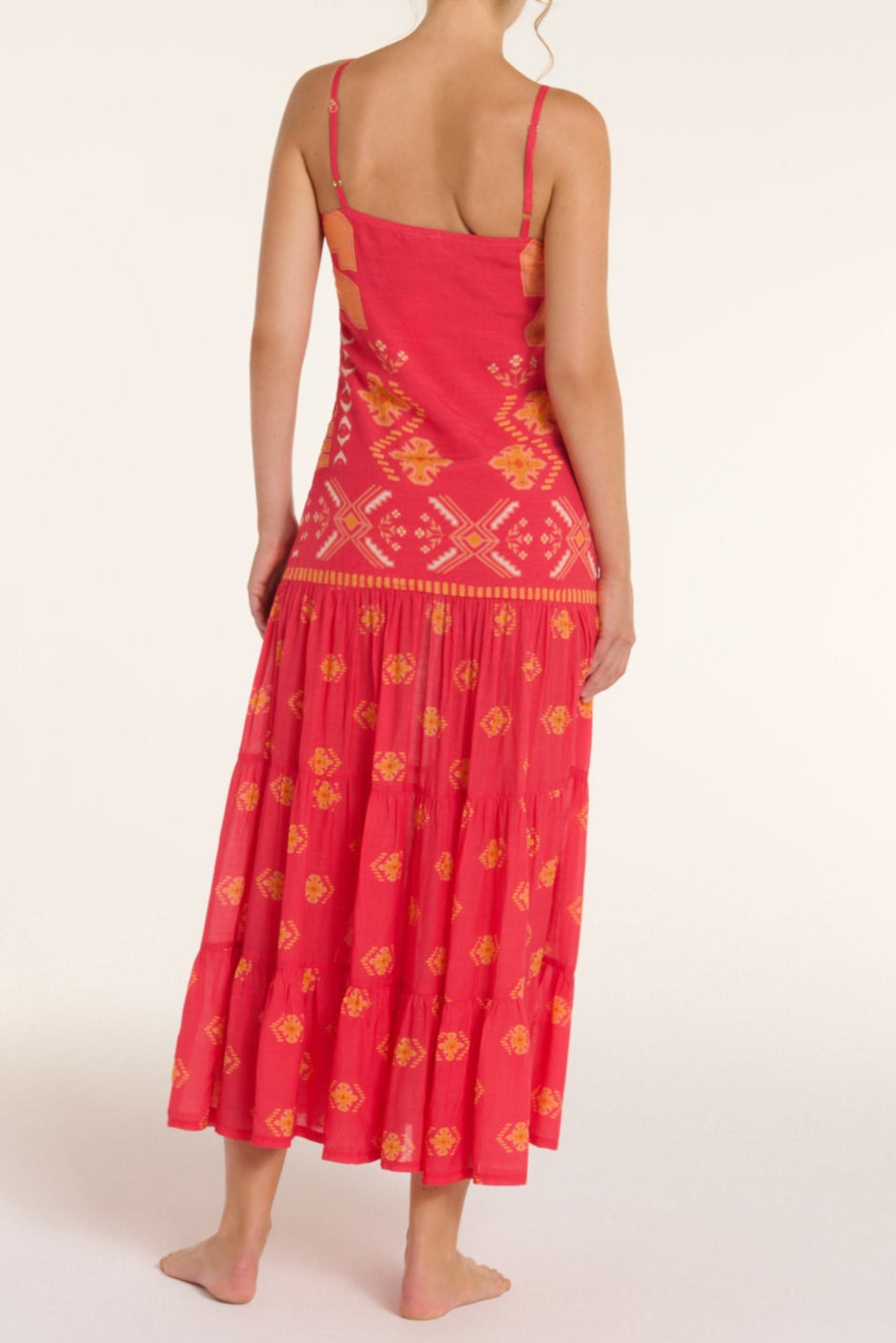Red dress with yellow patterns on a white background