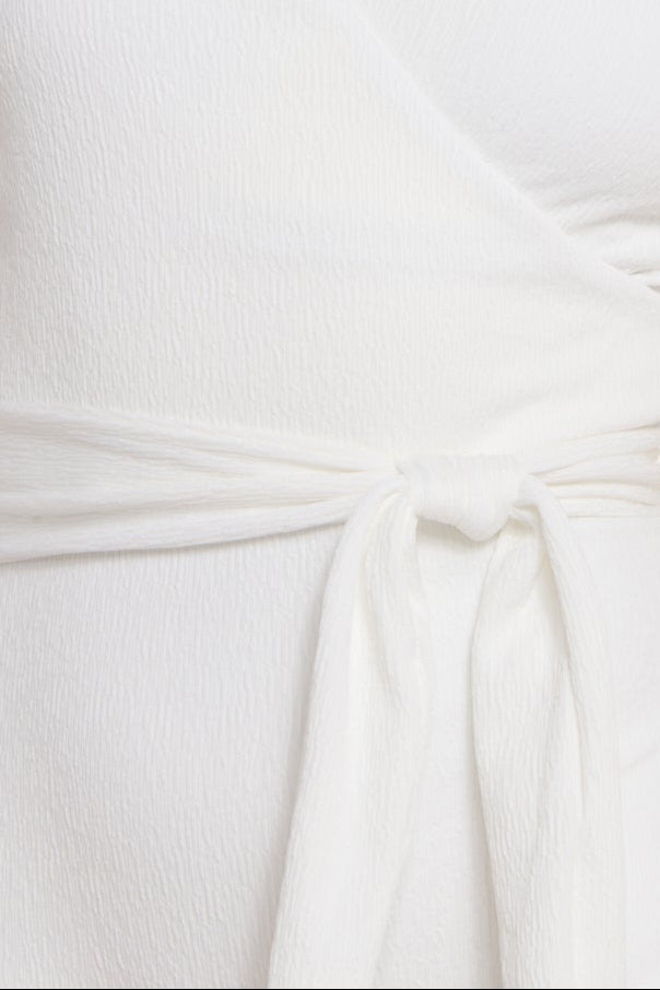 Close-up of white fabric with a knot