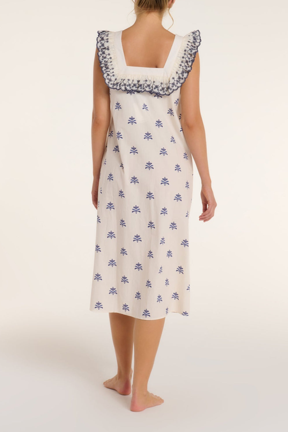 Woman wearing a floral dress on a white background