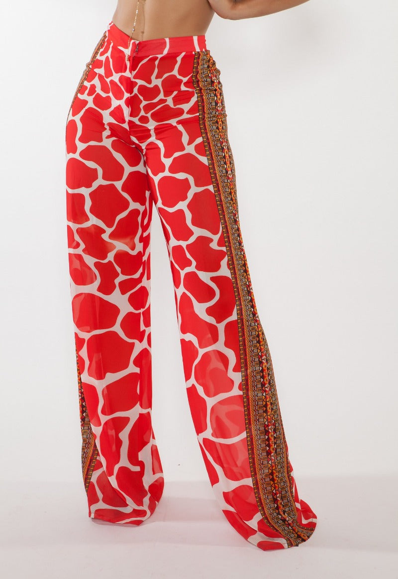 Red patterned pants with decorative side stripes on a white background