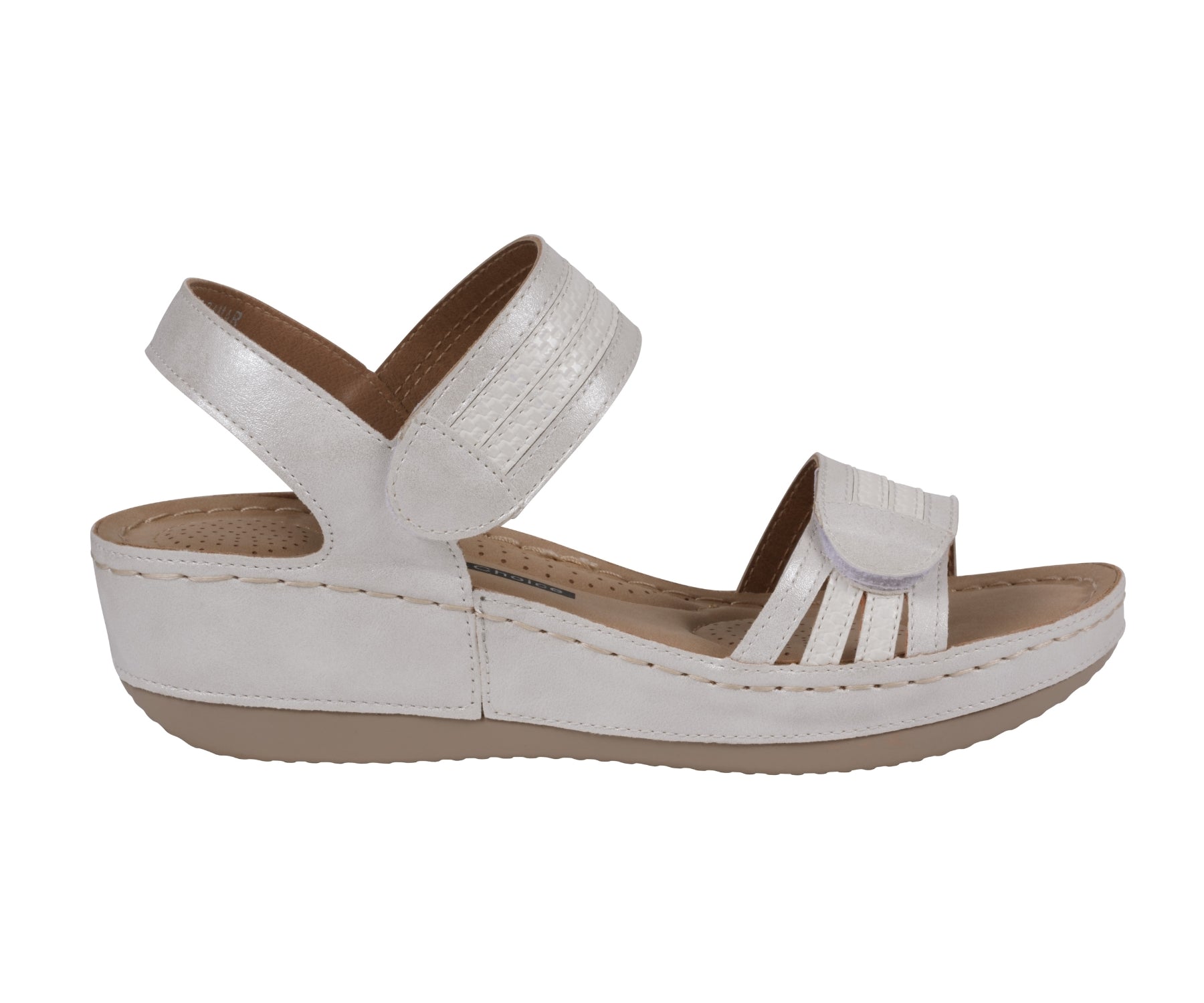 White sandal with brown sole on a white background