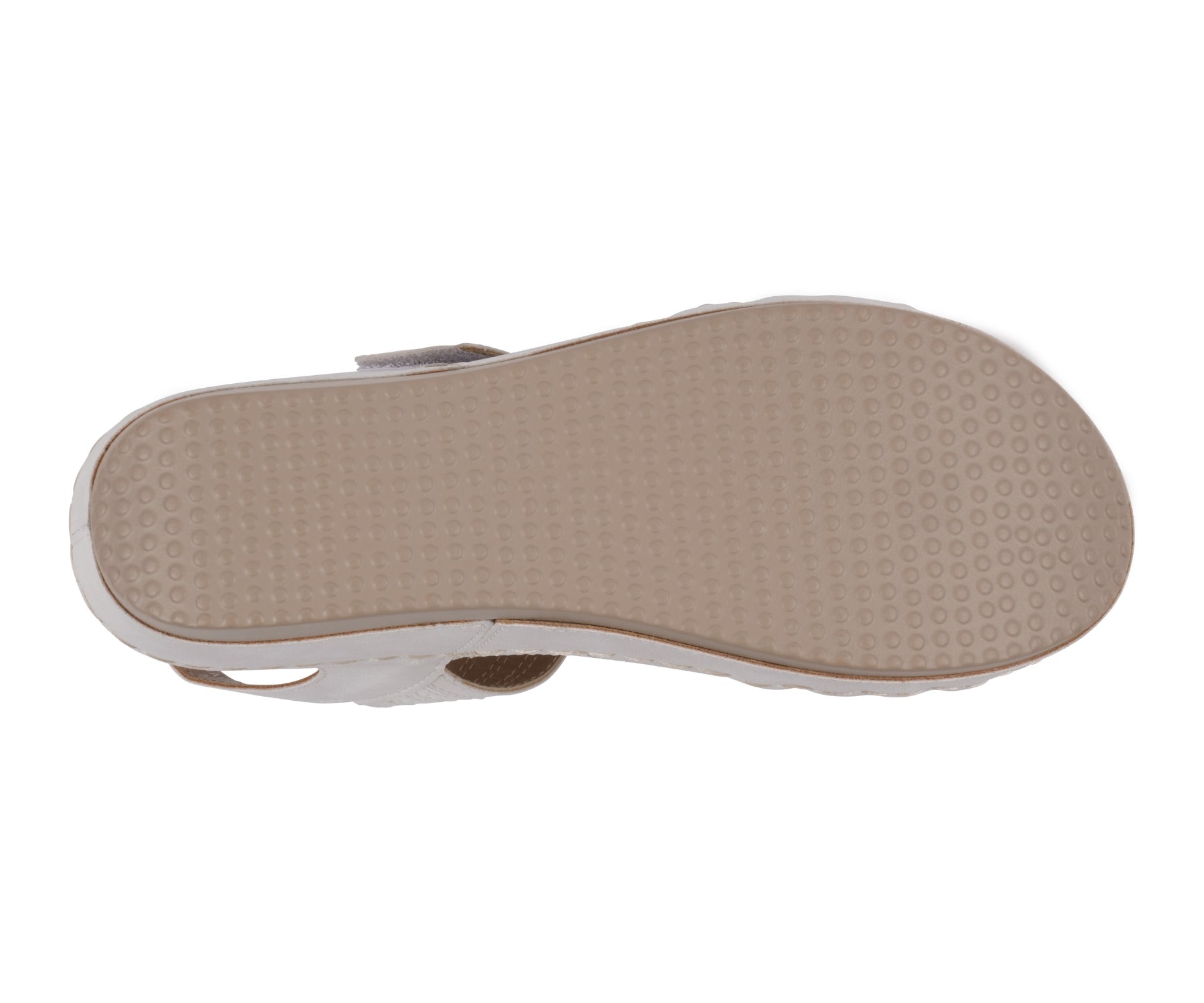 Close-up of a sandal sole with a textured surface on a white background