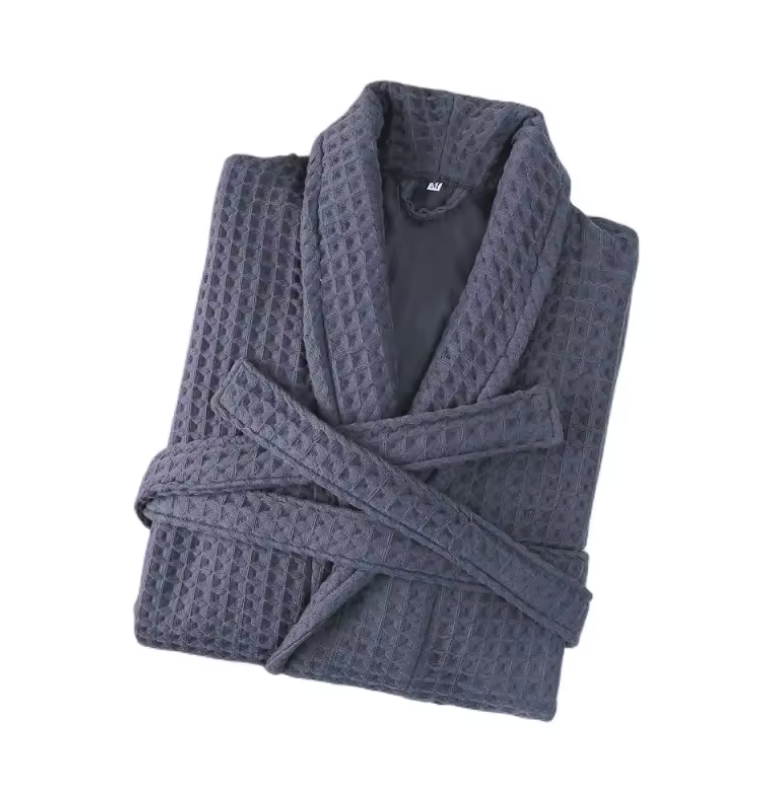 Folded dark gray waffle-textured robe on a white background