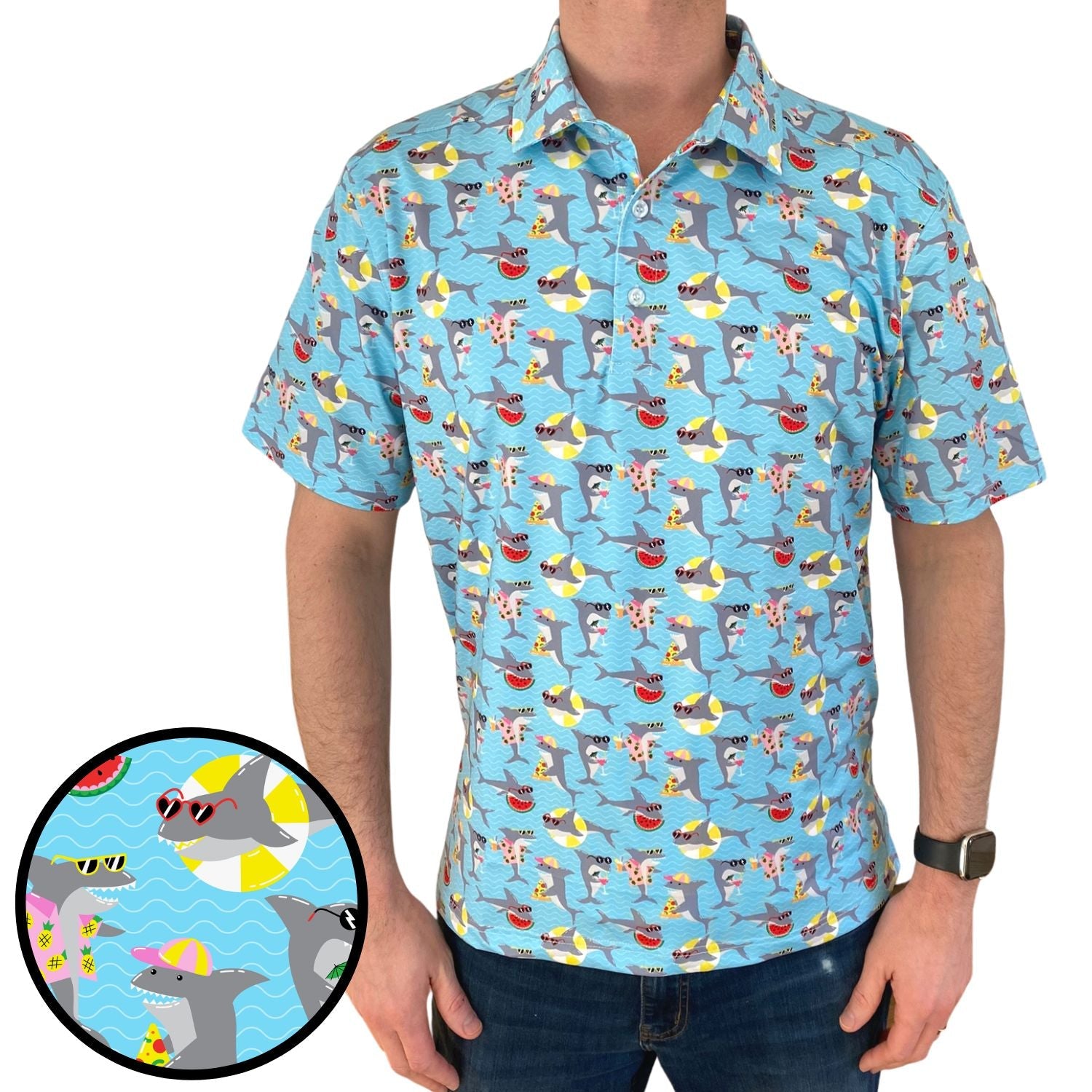 Man wearing a blue shirt with shark print, close-up of pattern shown.