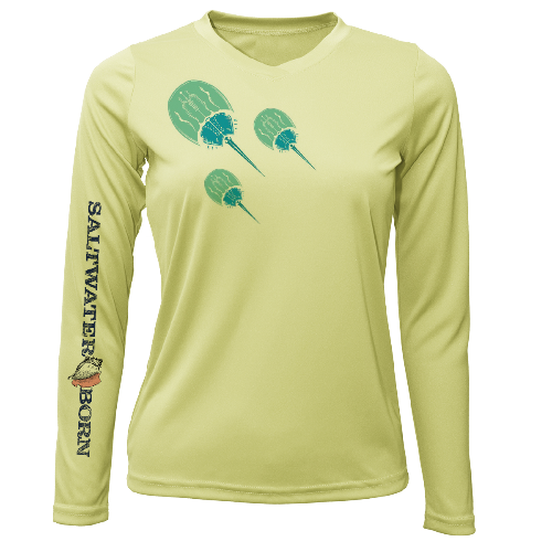 Light green long-sleeve shirt with 'Saltwater Born' branding and paddle graphic on a white background