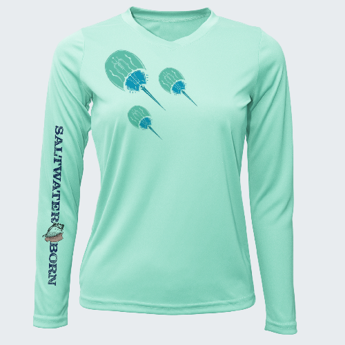 Mint green long-sleeve shirt with 'Saltwater Born' branding and paddle design on a white background