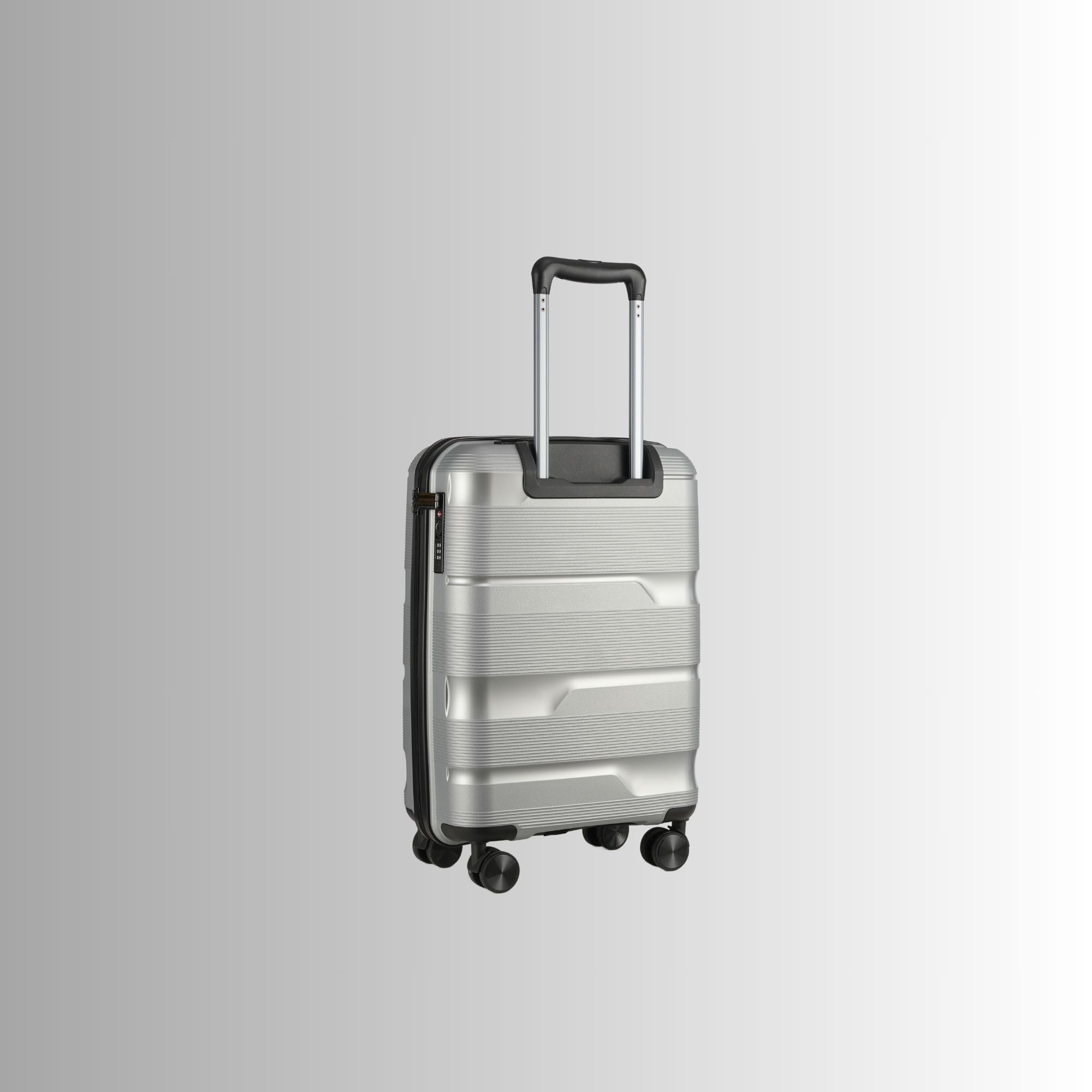 Silver suitcase with black handle and wheels on a light gray background
