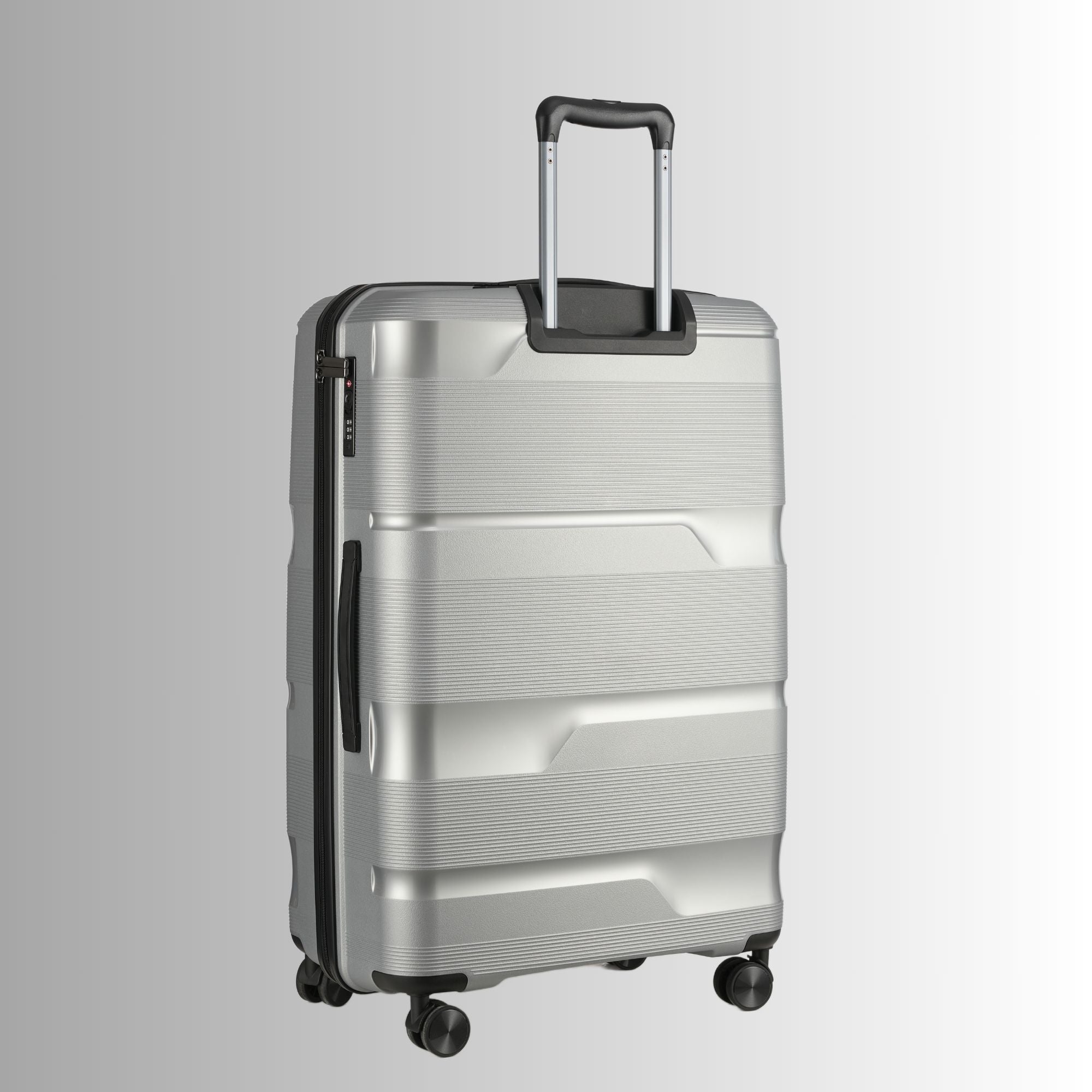 Silver suitcase with a textured surface on a light gray background