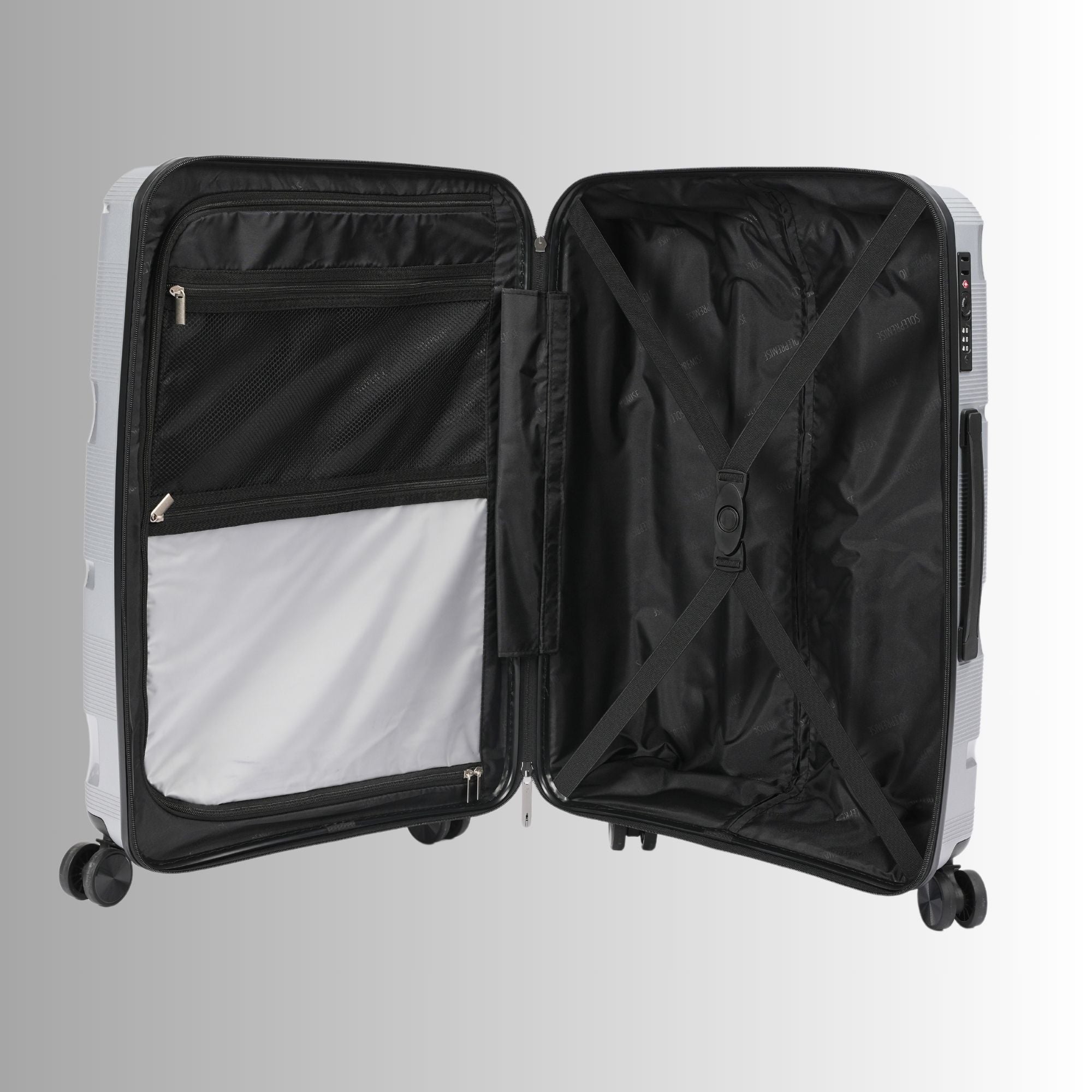 Open suitcase with black interior on a light gray background
