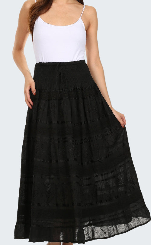 Woman wearing a black lace skirt over a white top on a white background