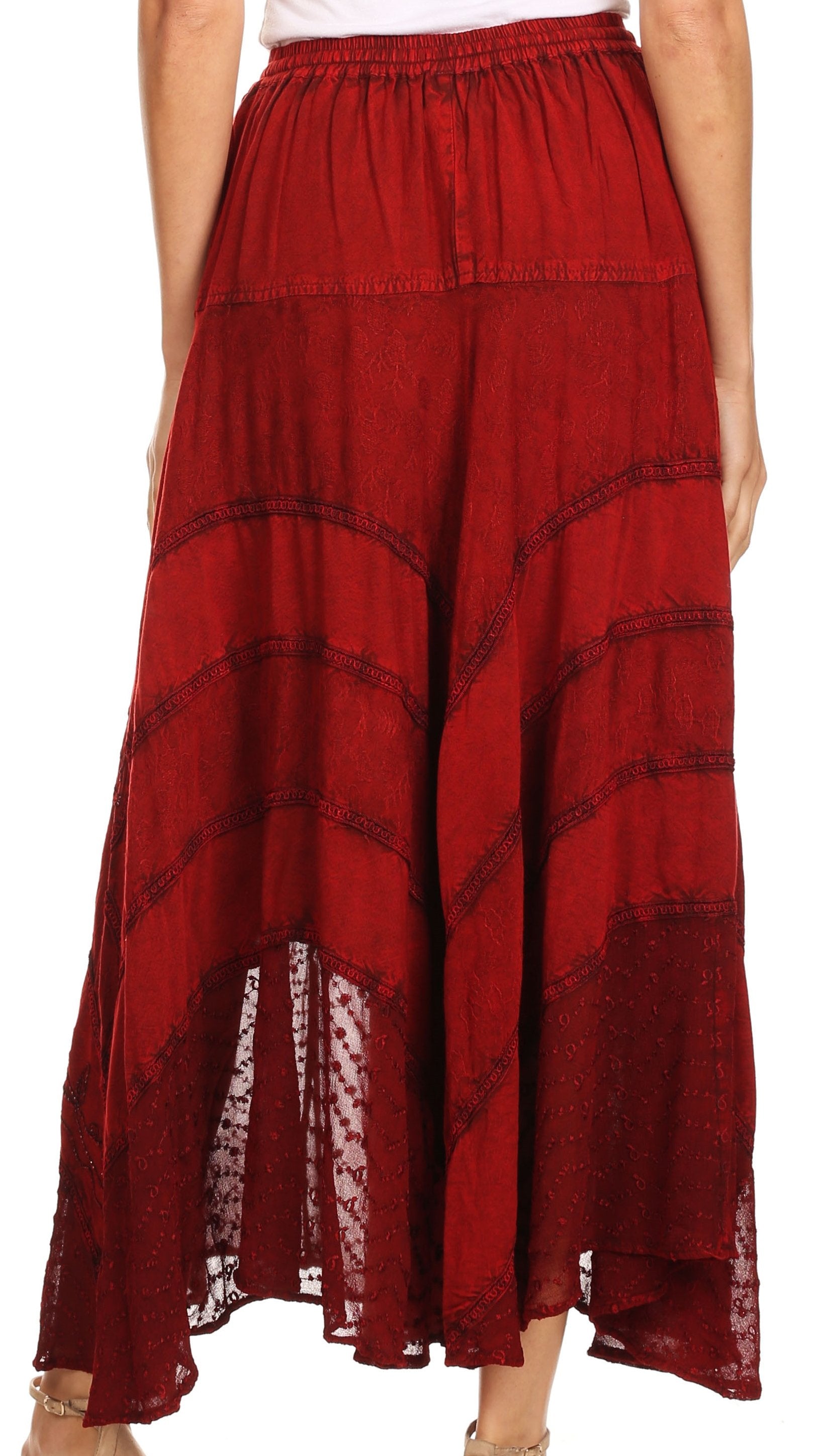 Red patterned pants worn by a person on a white background