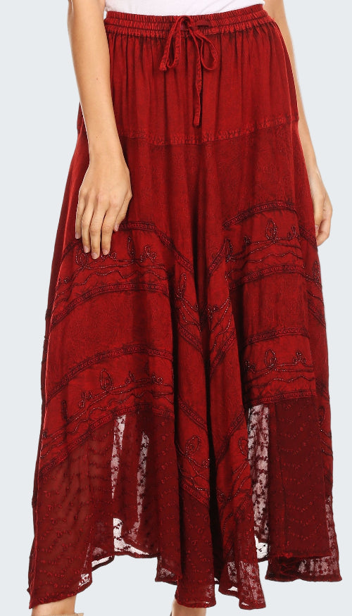 Red patterned skirt worn by a person on a white background