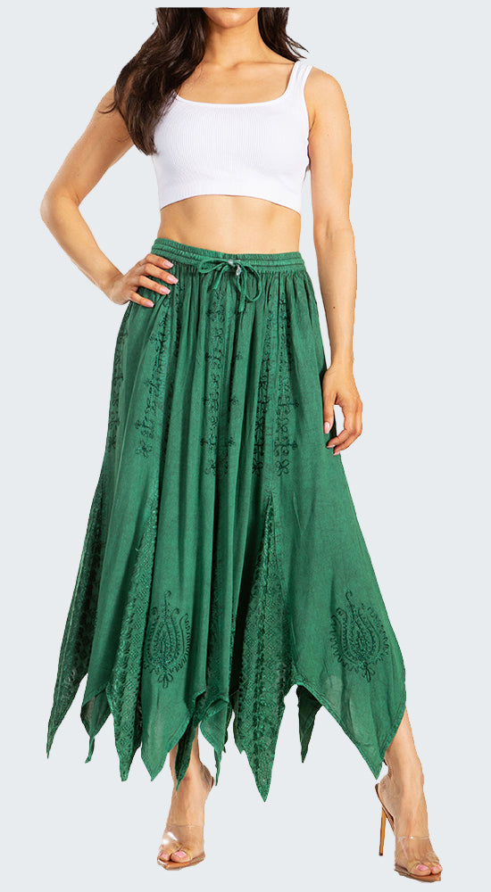 Woman wearing a white crop top and green lace skirt on a white background