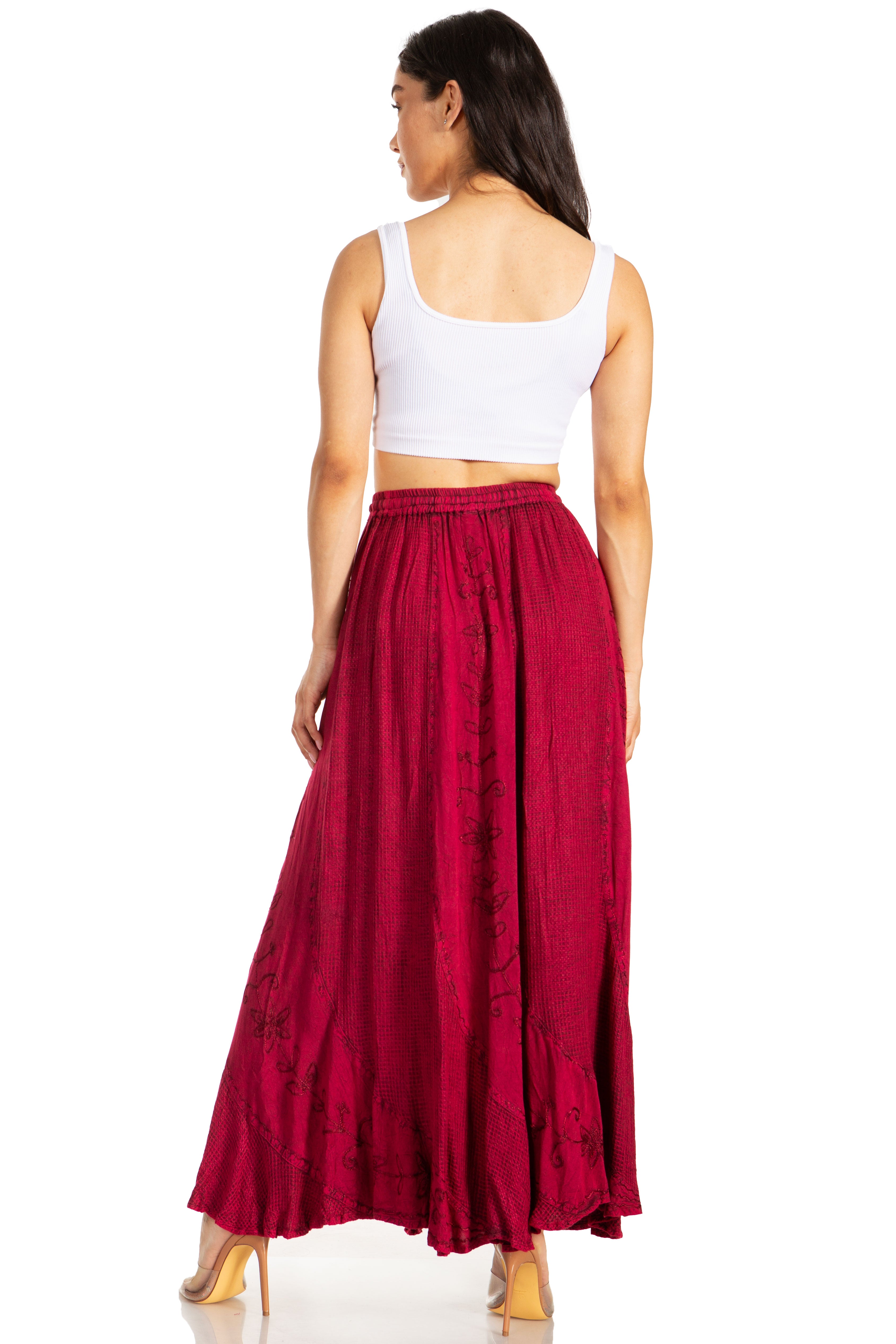 Woman wearing a white top and red skirt on a white background