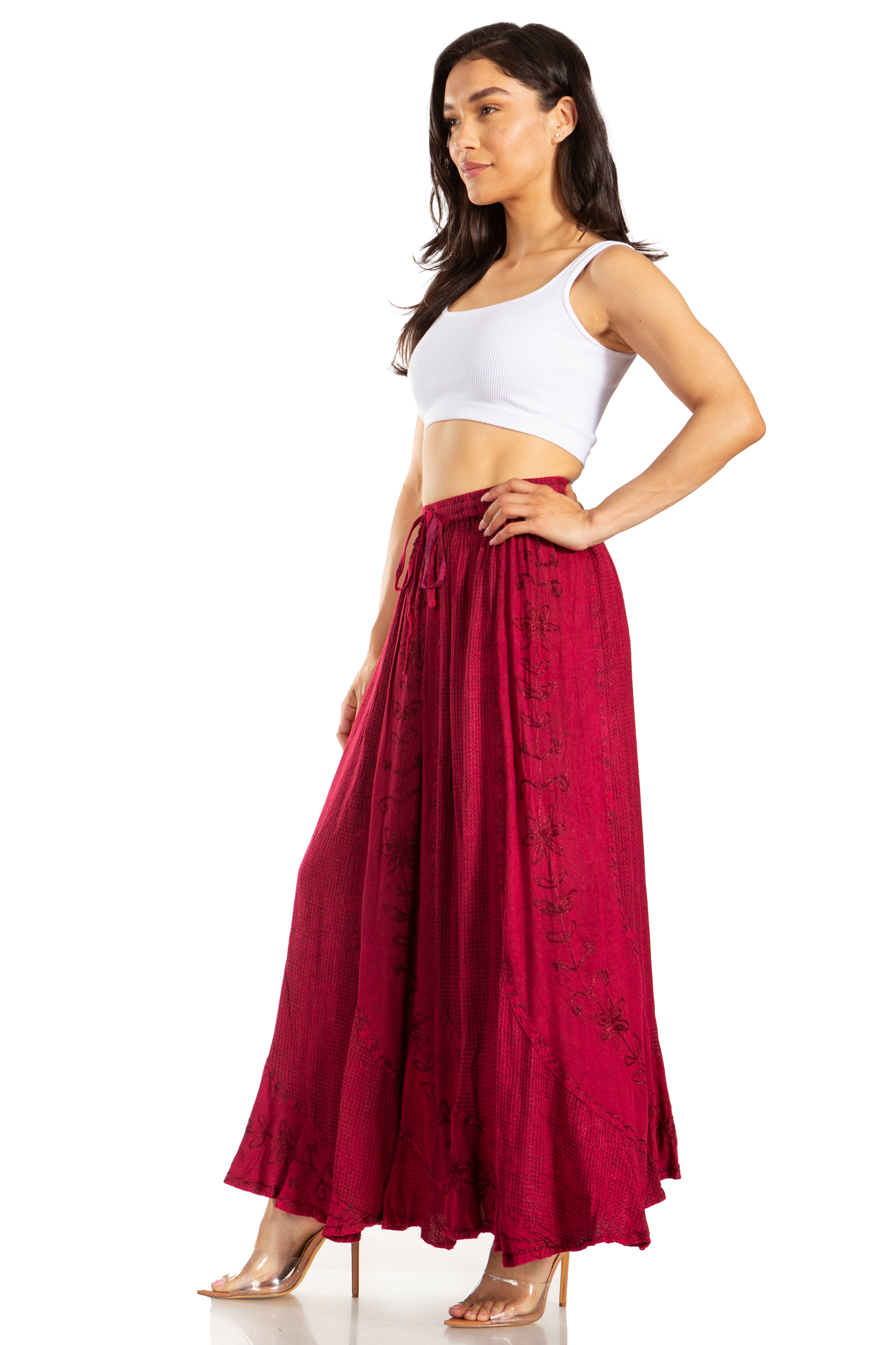 Woman wearing a white top and red skirt on a white background