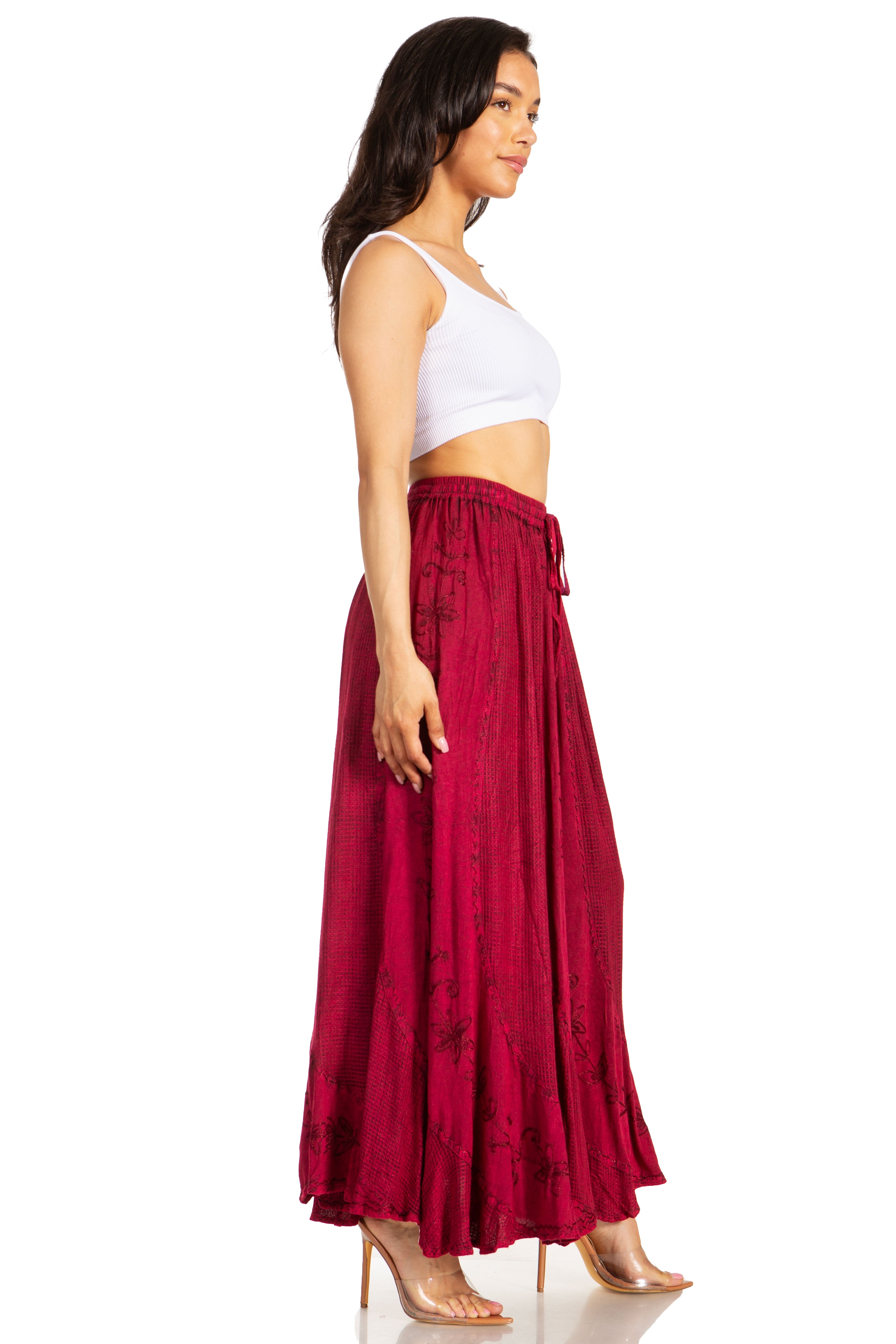 Woman wearing a white top and red skirt on a white background