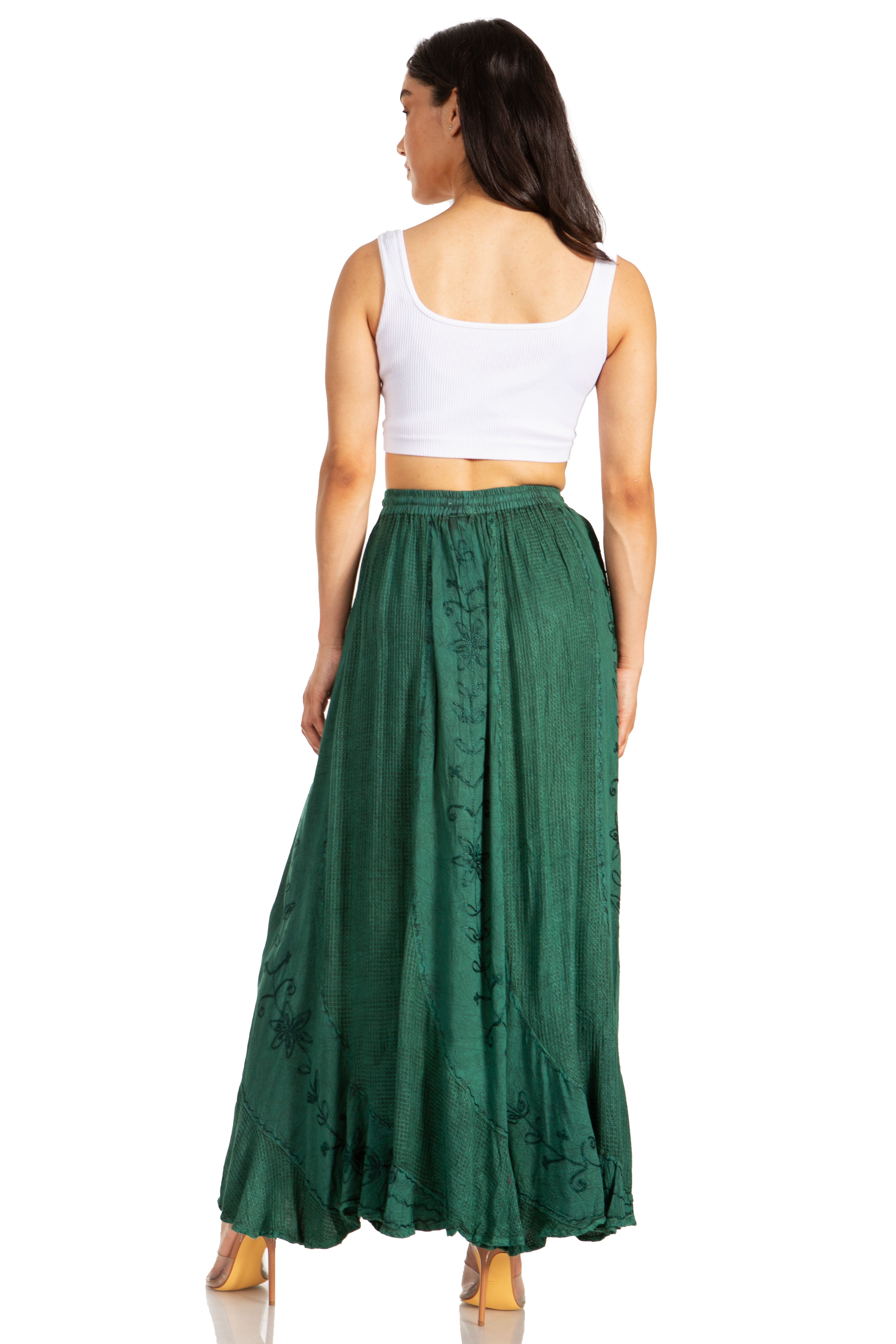 Woman wearing a white top and green skirt on a white background