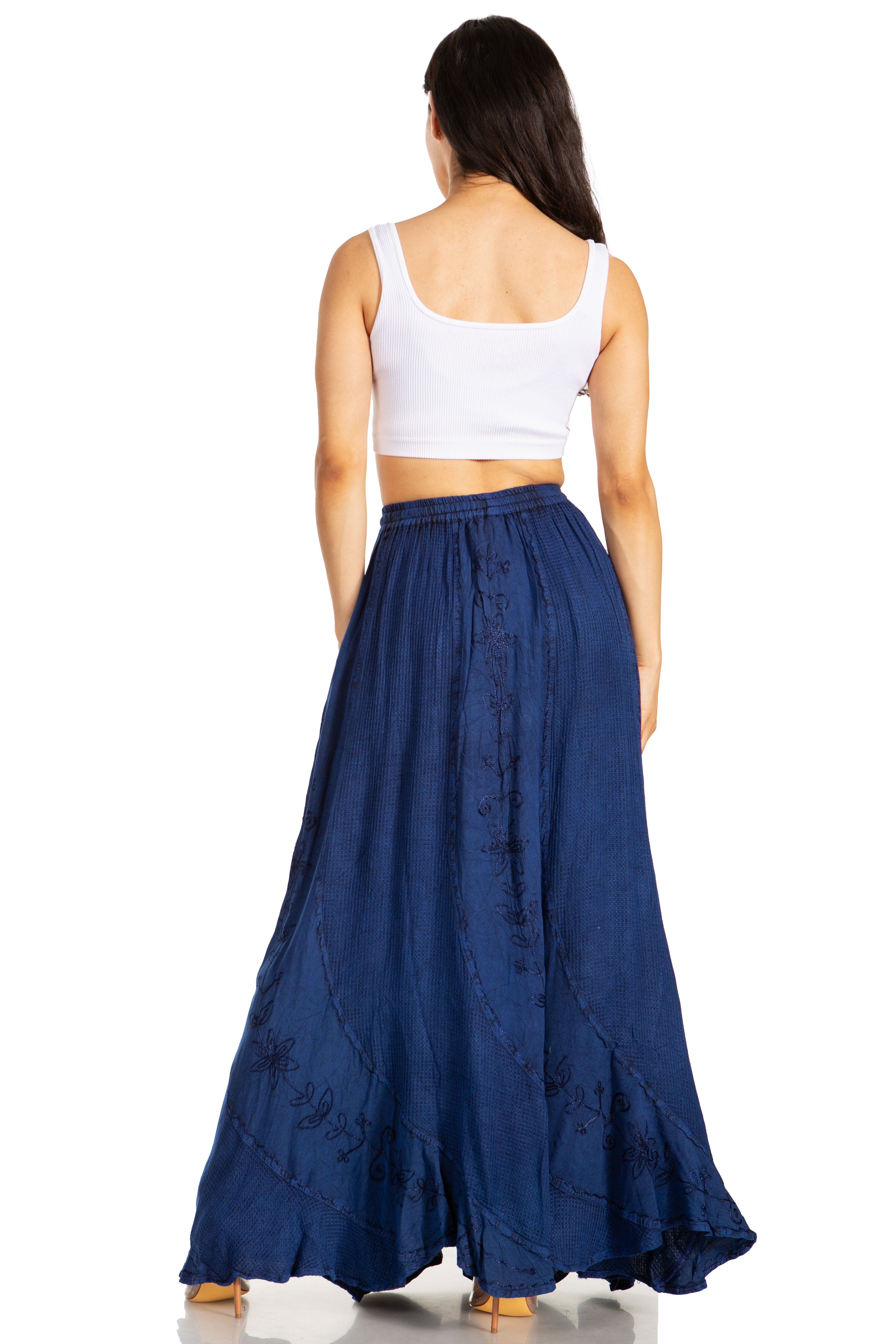Woman wearing a white top and blue skirt on a white background