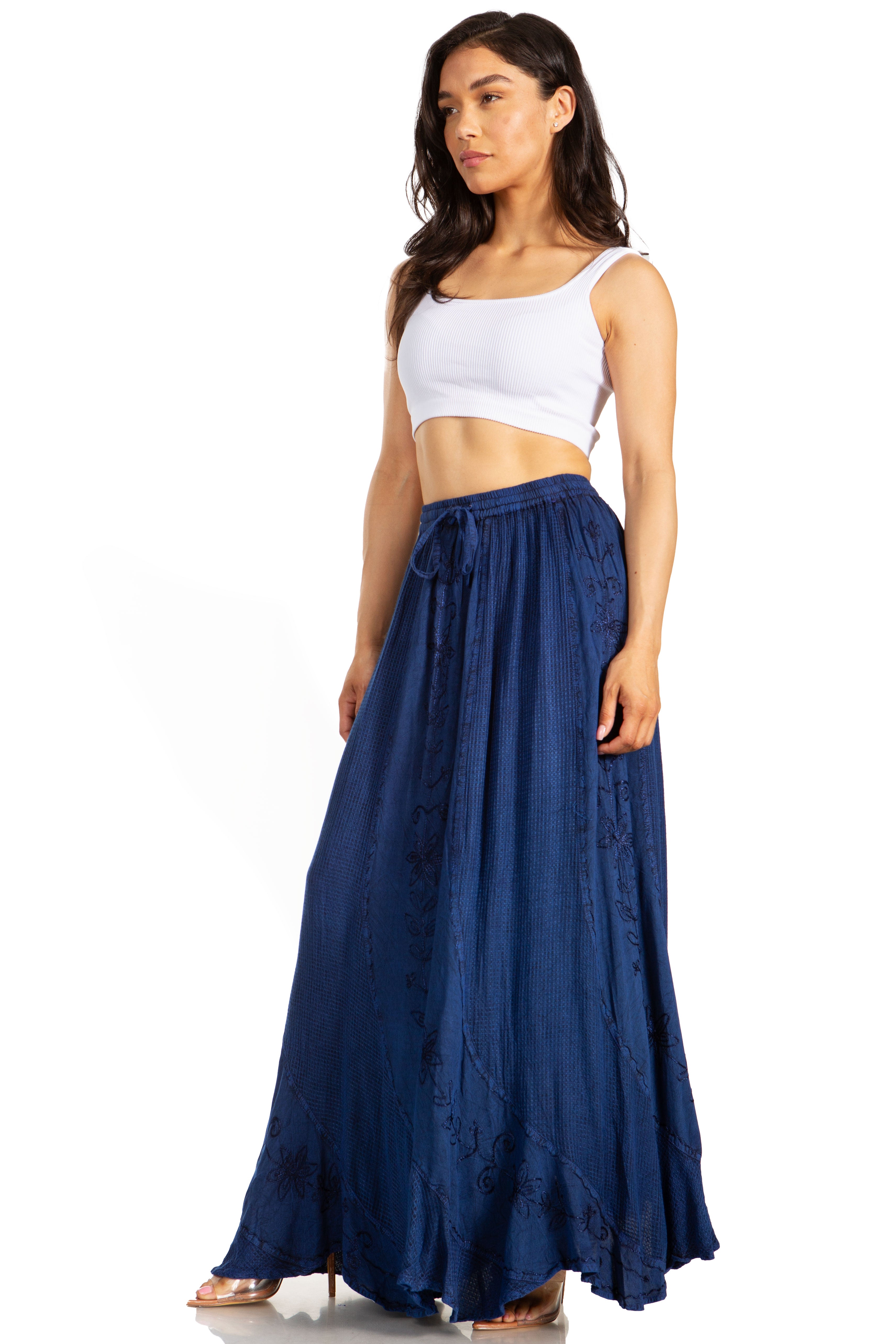 Woman wearing a white top and blue skirt on a white background