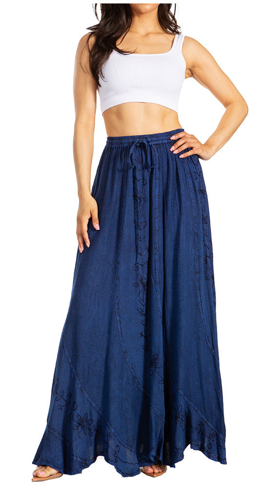 Woman wearing a blue denim skirt with a white top on a white background