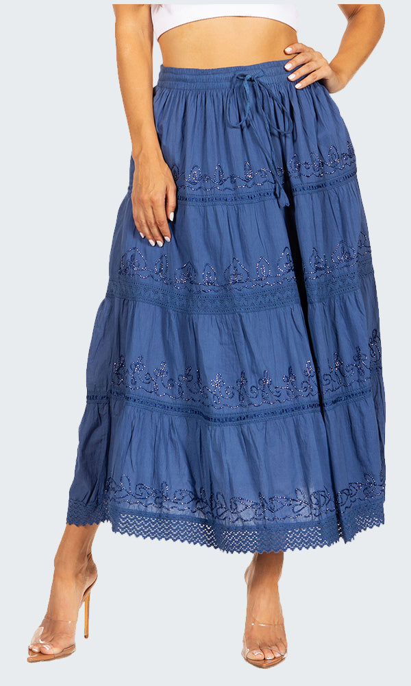 Blue tiered skirt with lace details worn by a person on a white background