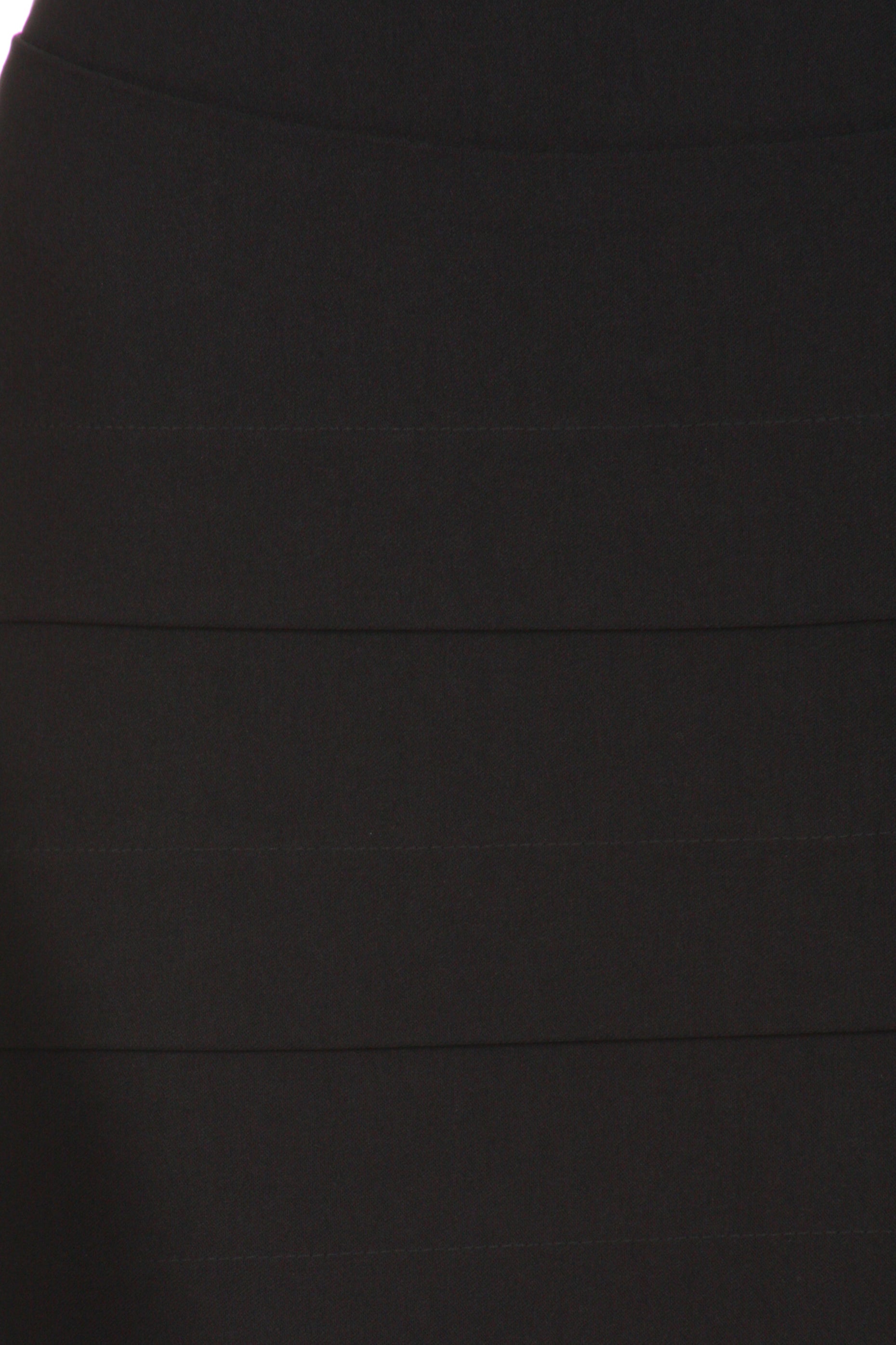 Close-up of a black skirt with a focus on texture and color.