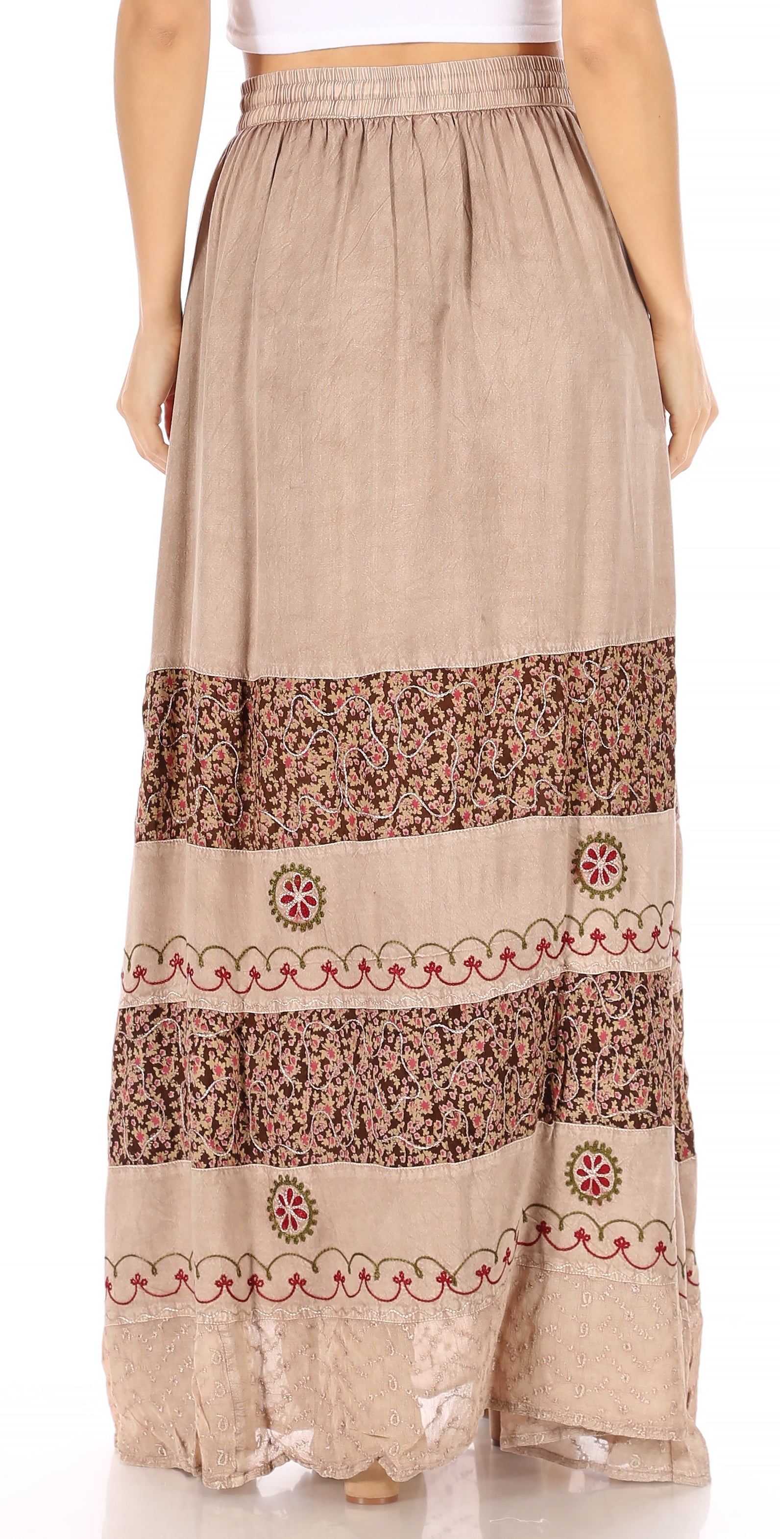 Long beige skirt with brown floral patterns on a white background