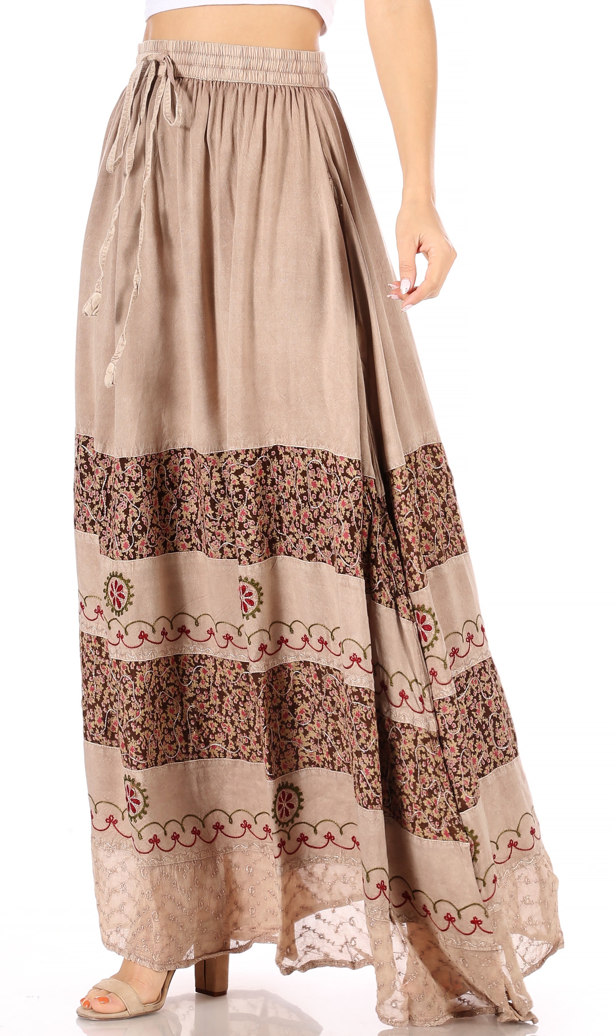 Beige long skirt with floral patterns on a white background