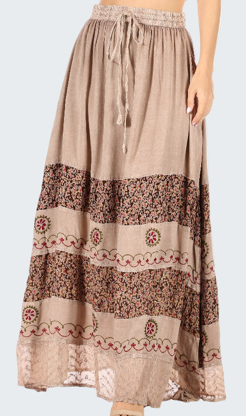 Beige long skirt with floral patterns on a white background