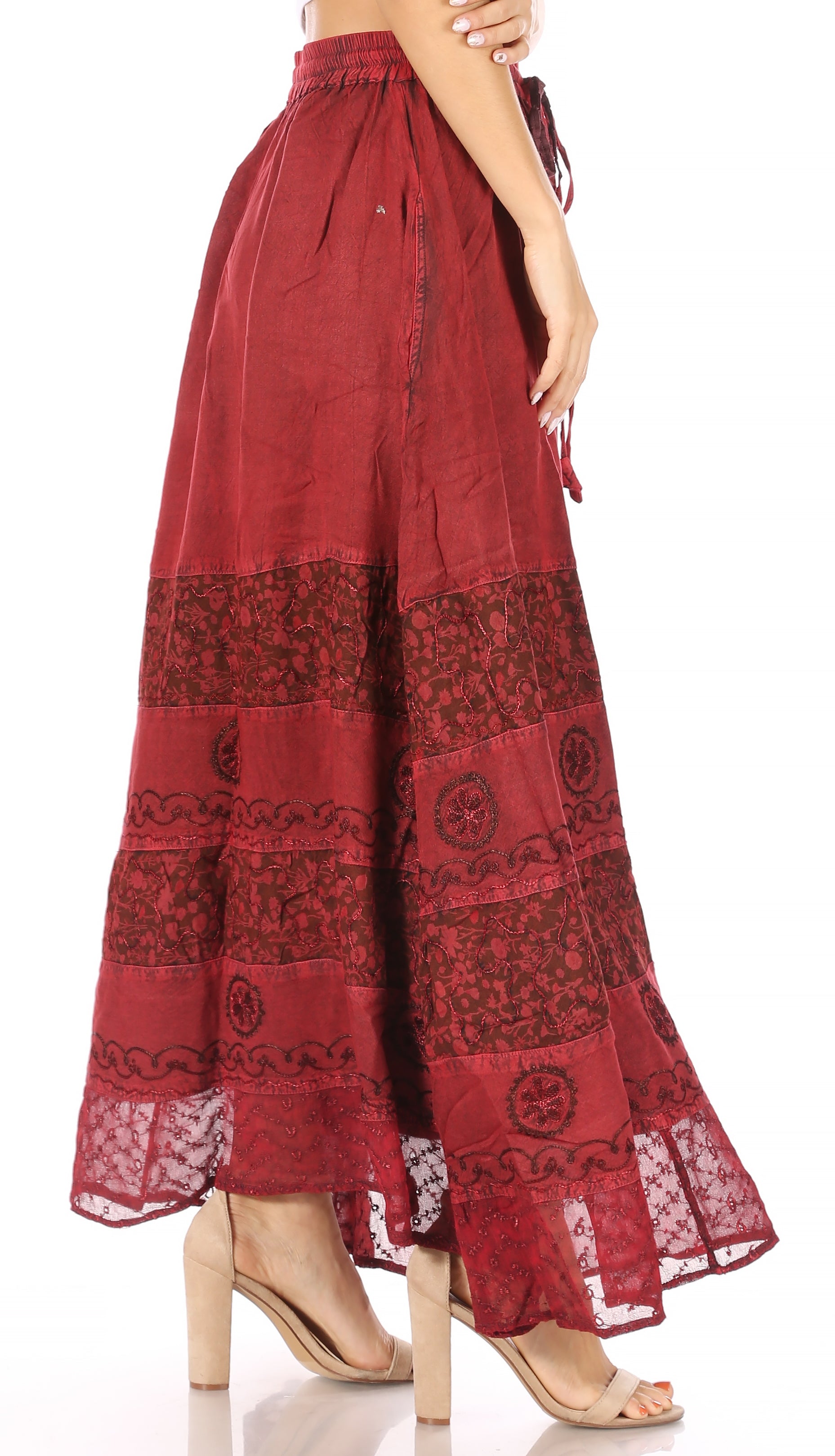 Red patterned pants worn by a model on a white background