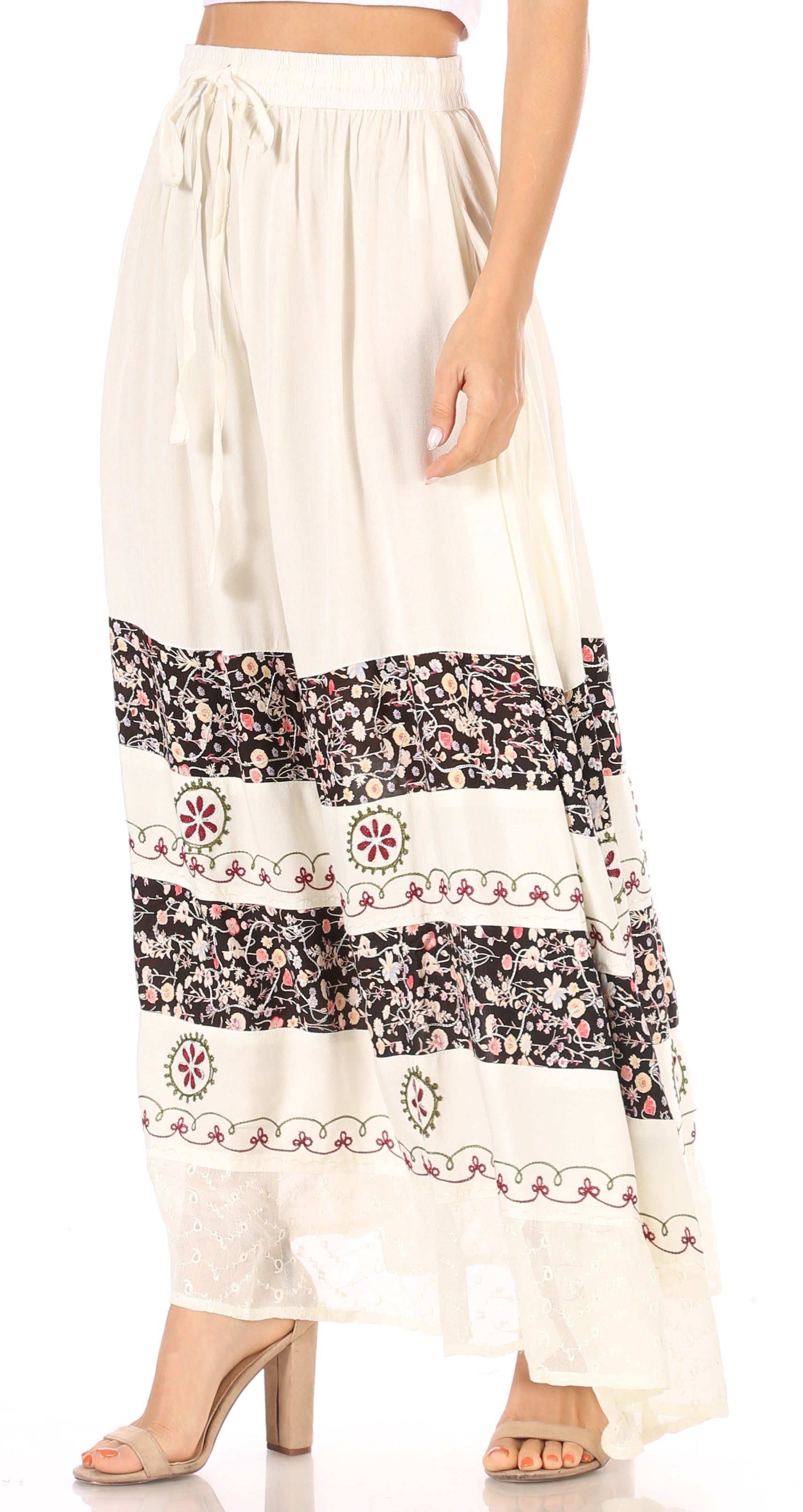 Long white skirt with black floral patterns on a white background