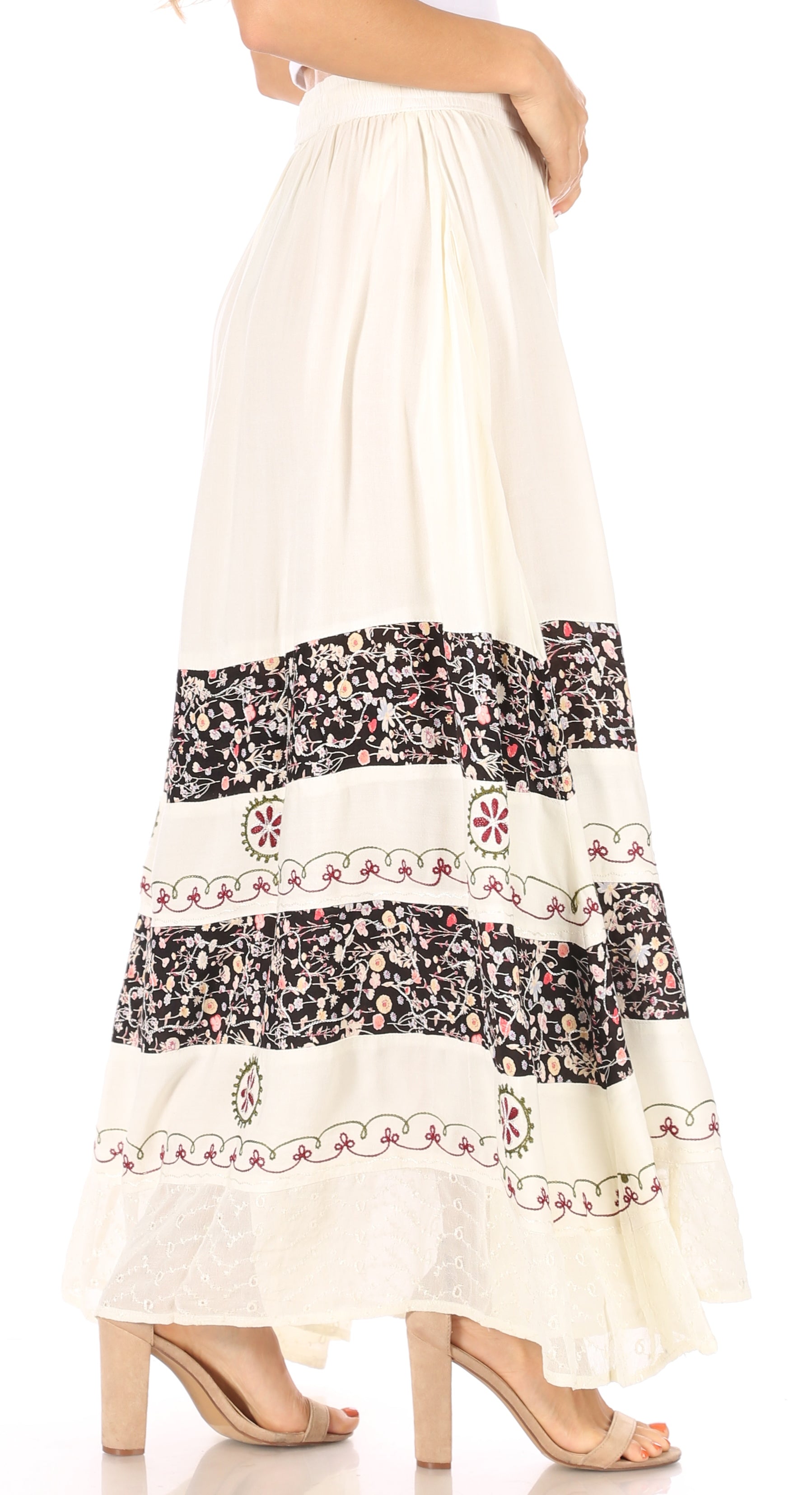 Long white skirt with black and red floral patterns on a white background