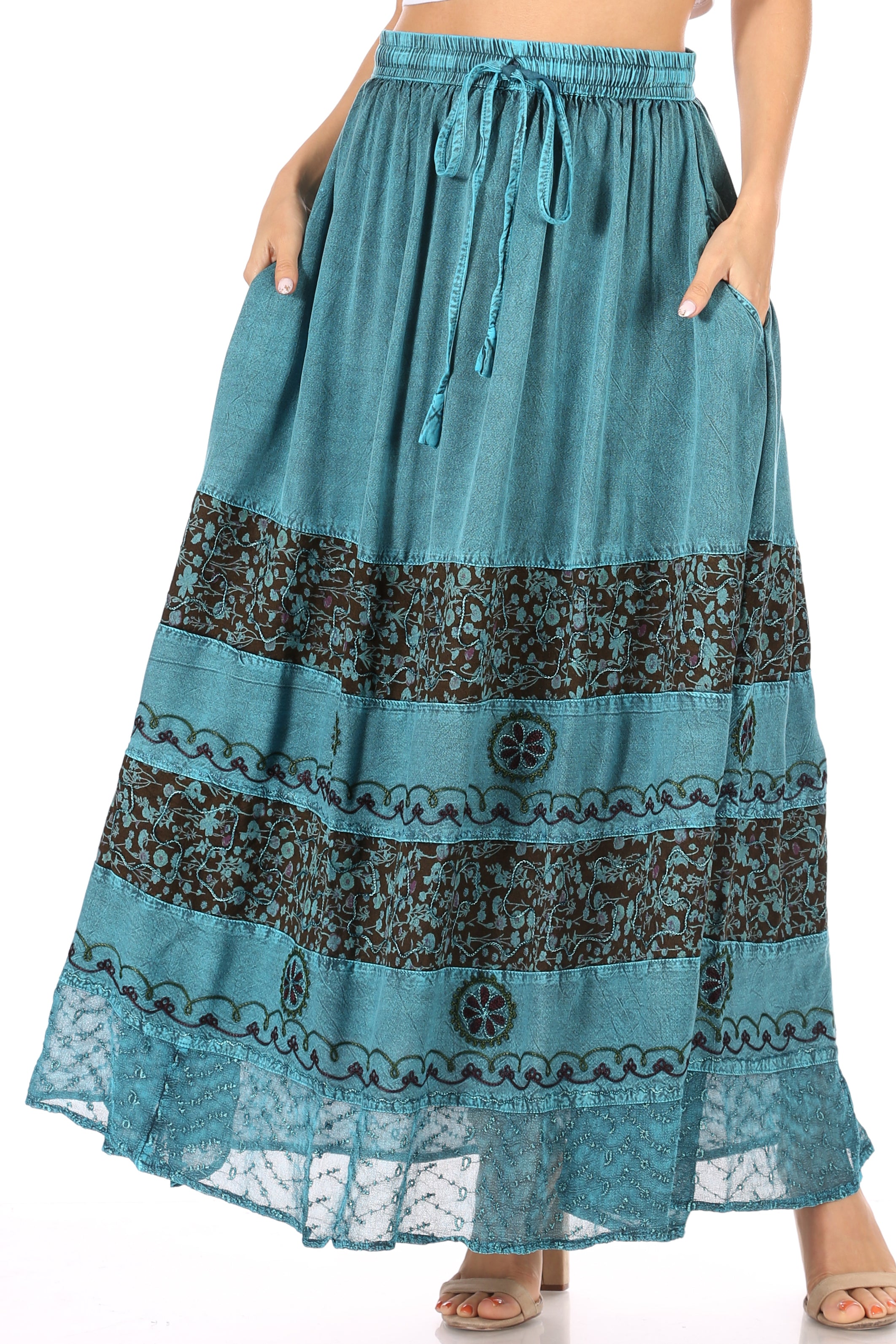Teal and black patterned maxi skirt on a white background