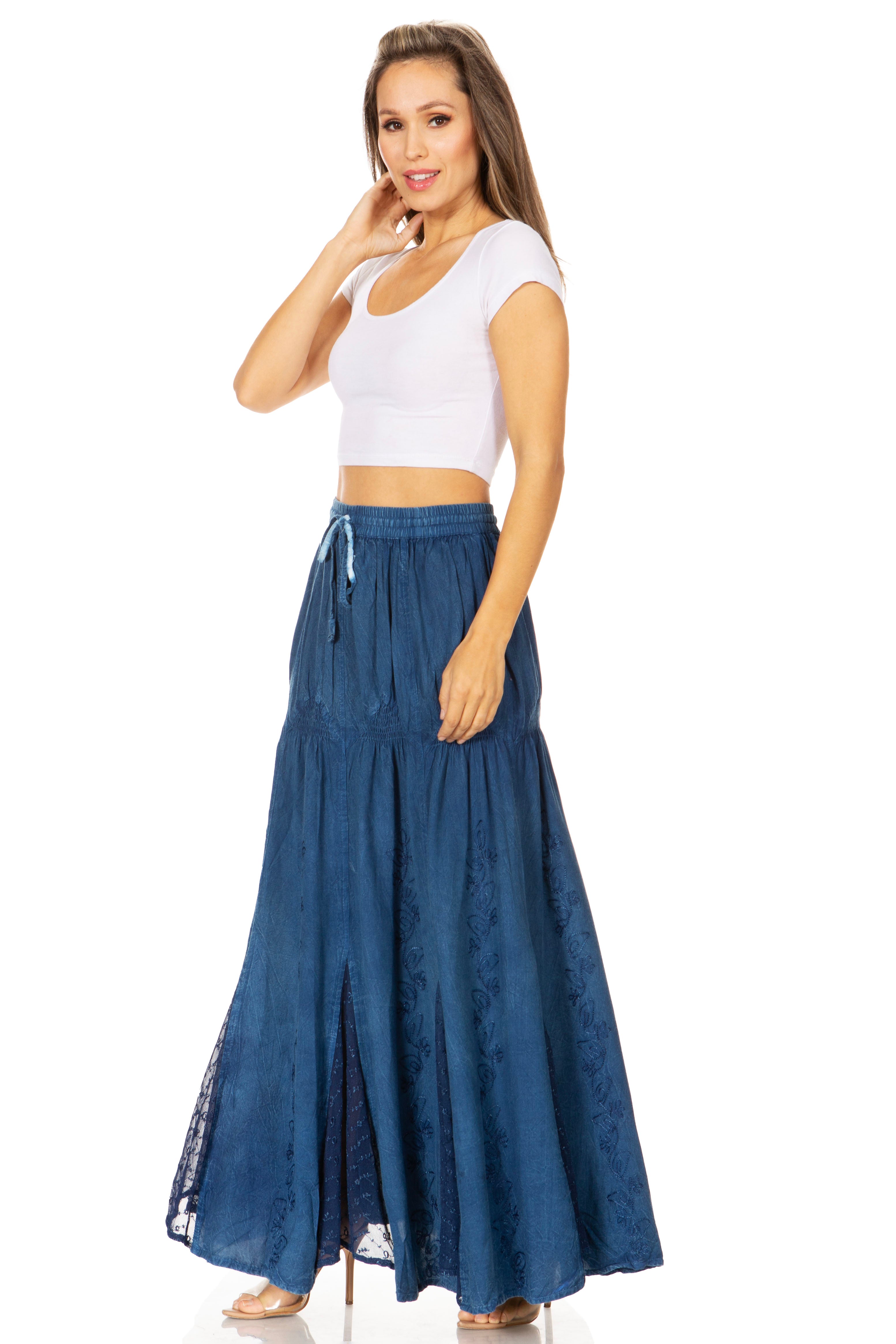 Woman wearing a white top and blue denim skirt on a white background