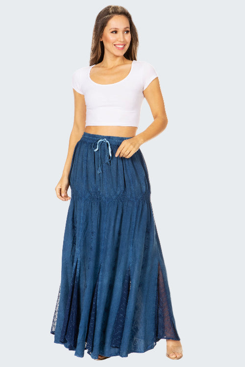 Woman wearing a white crop top and blue denim skirt on a white background
