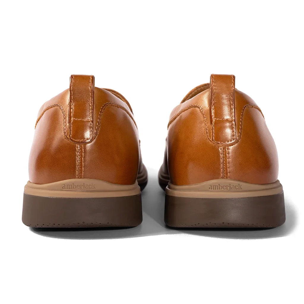 Pair of brown leather shoes on a white background