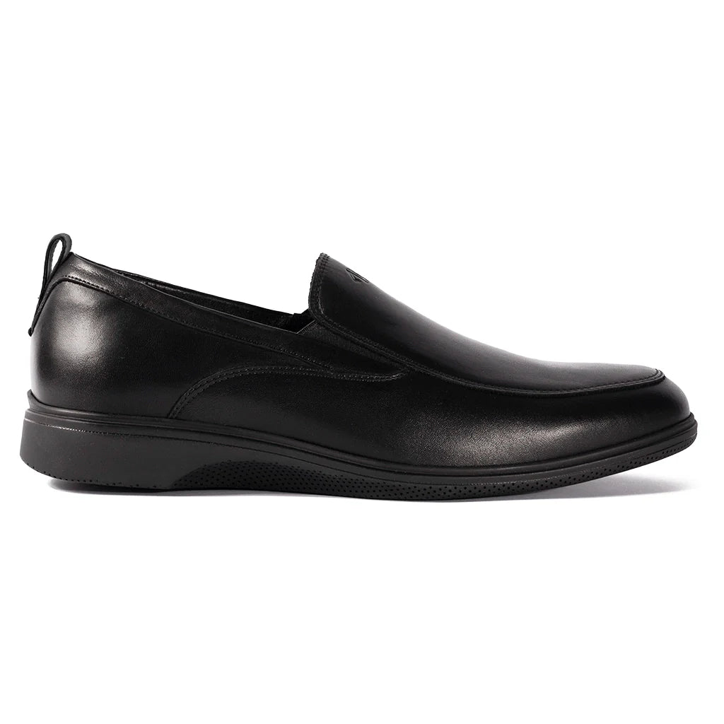 Black slip-on shoe on a white background