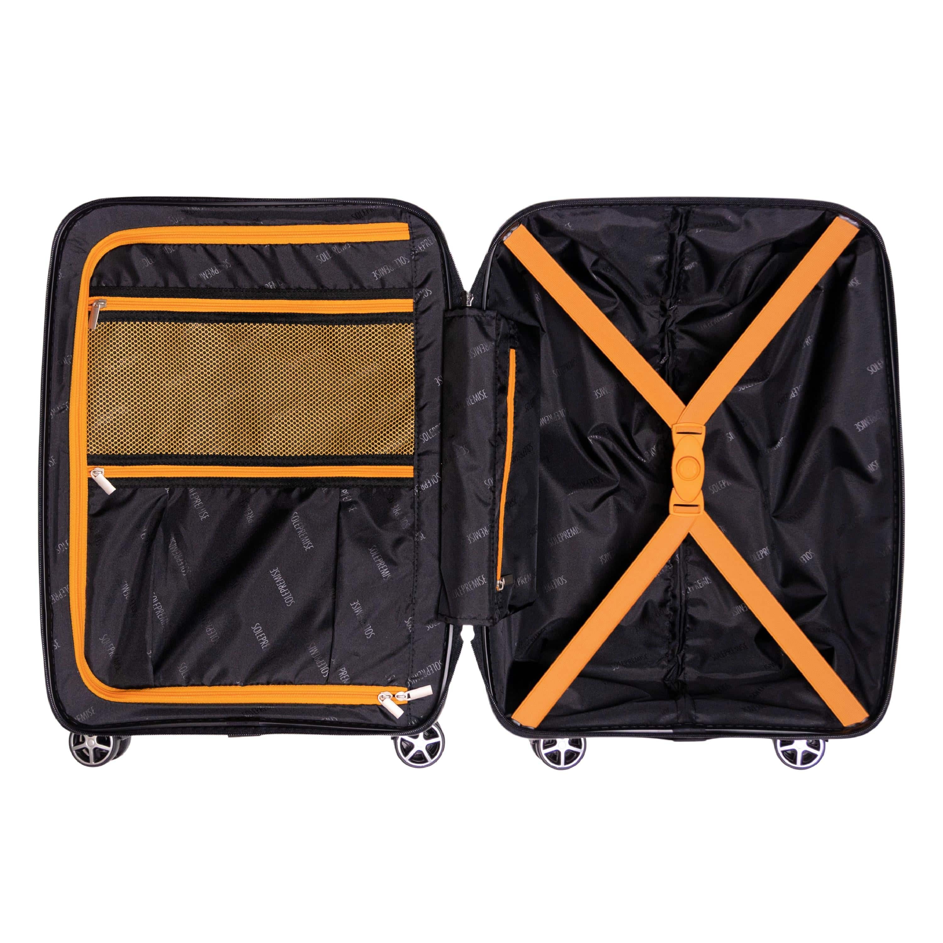 Black suitcase with orange accents open on a white background