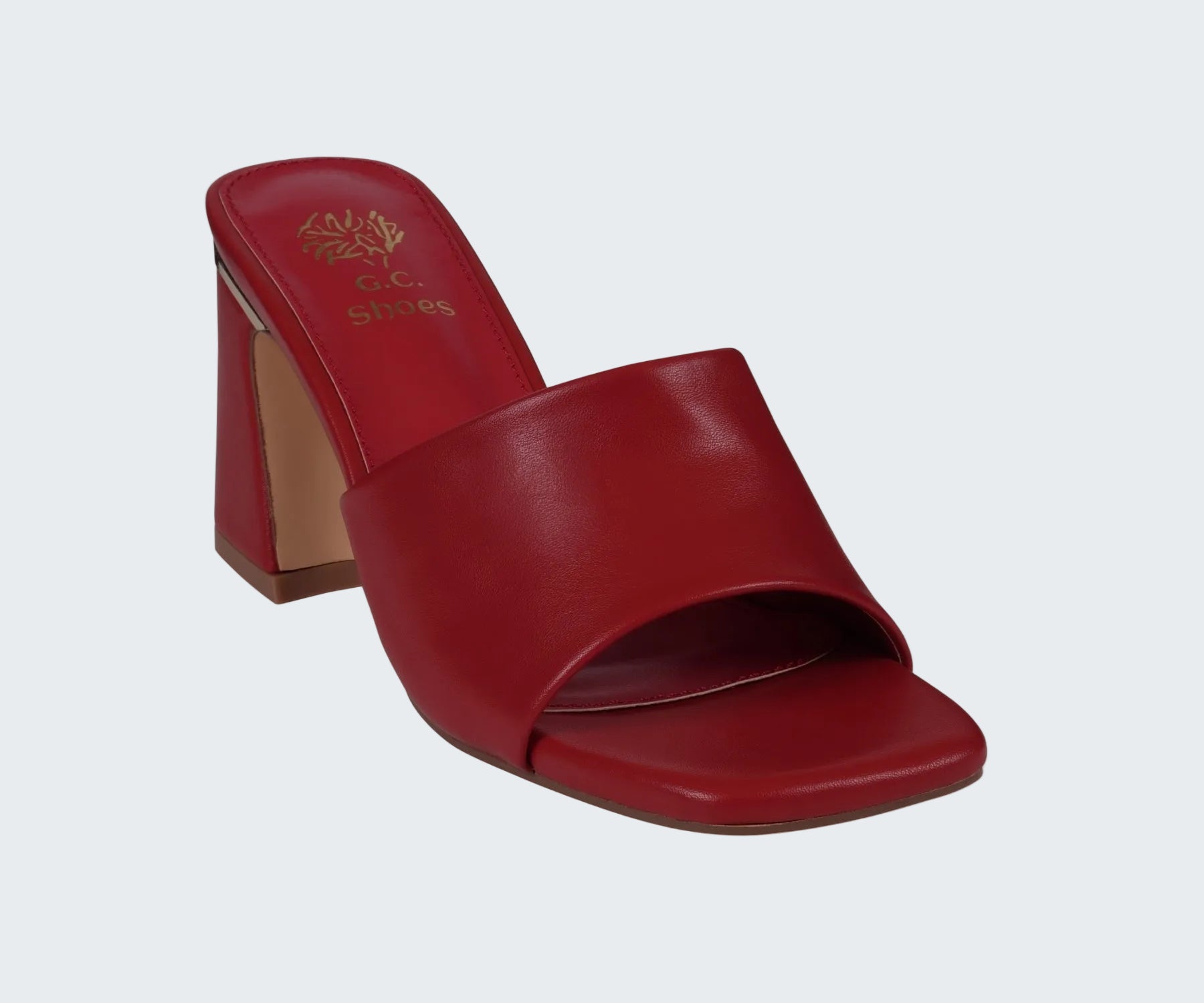 Red sandal with a high heel on a white background