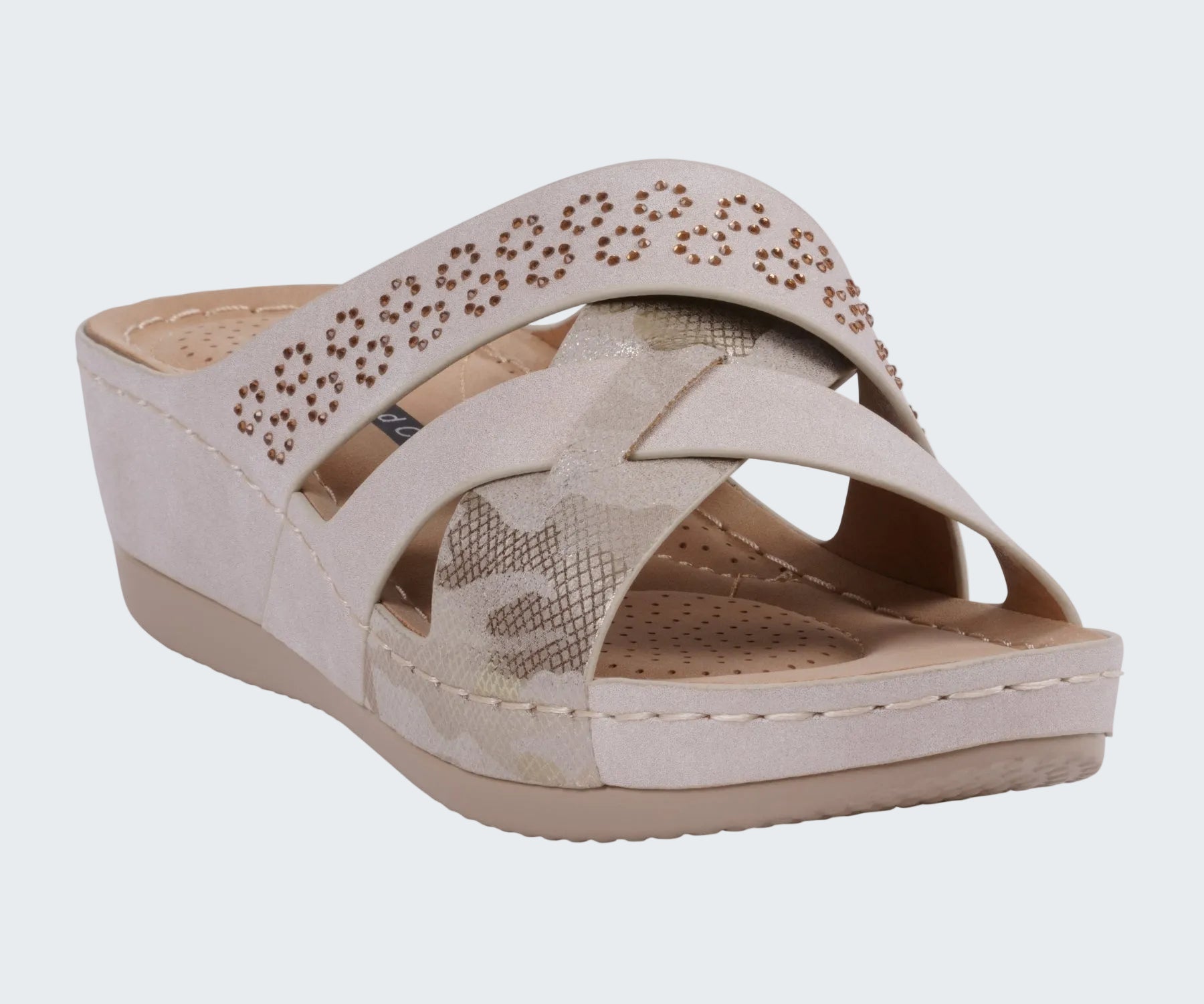 Beige wedge sandal with star design on a white background