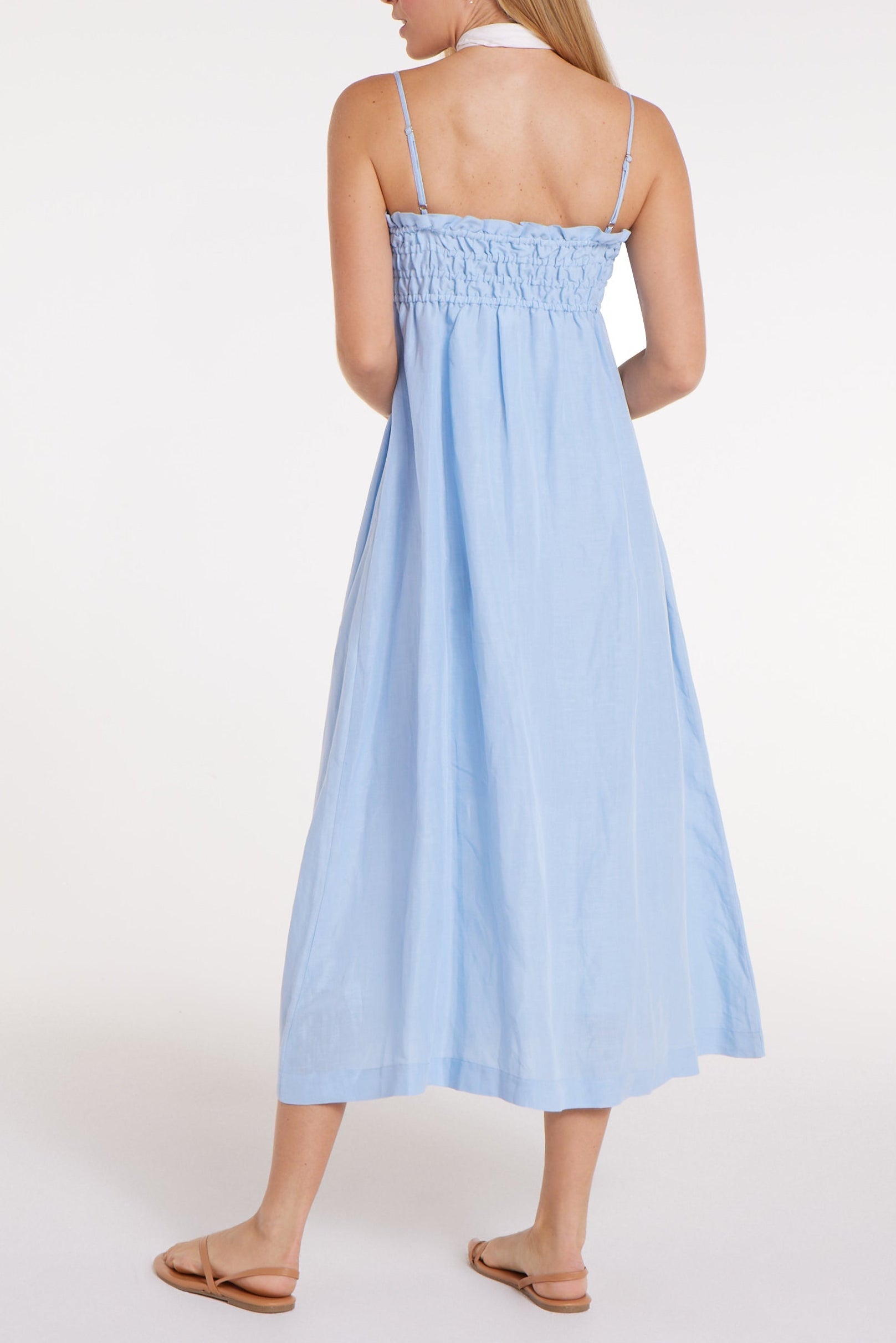Light blue dress worn by a person on a white background