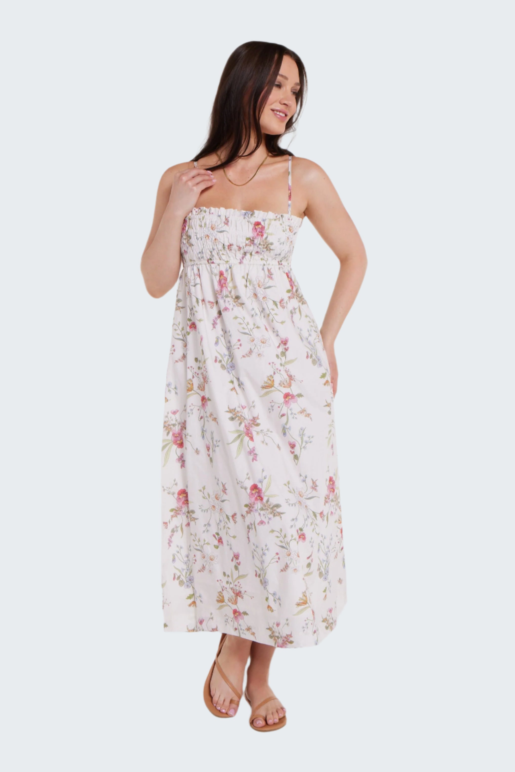 Woman wearing a floral dress on a white background