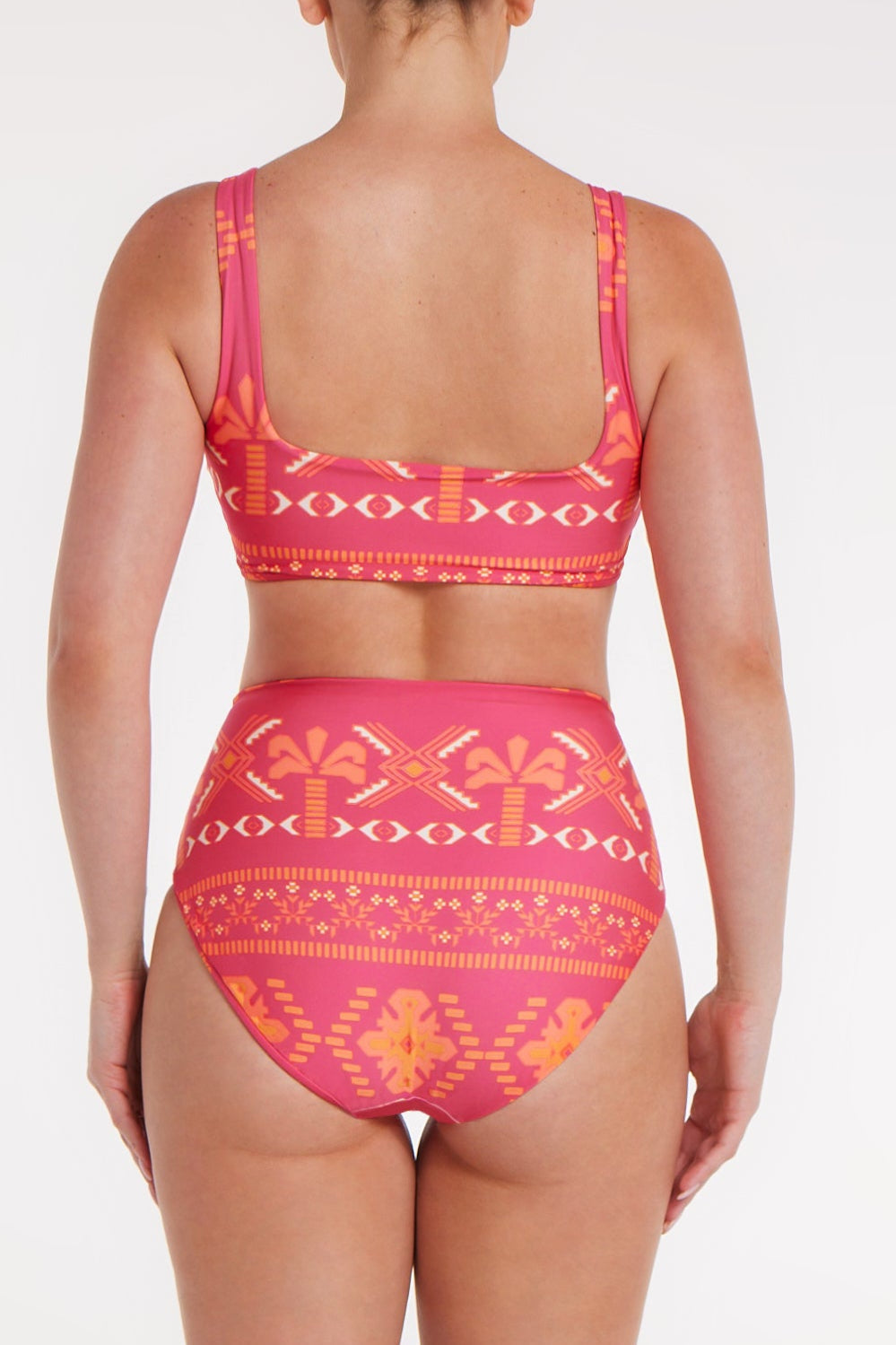 Pink and orange patterned bikini on a white background